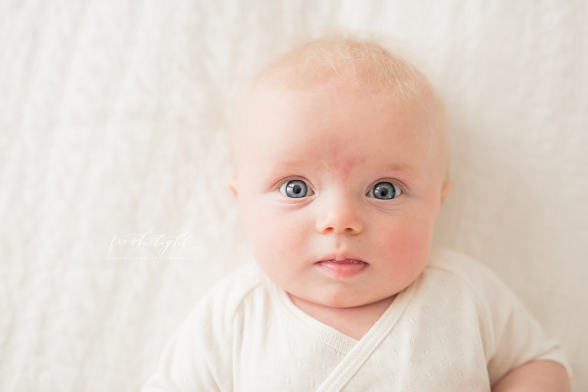 blue eyed baby close-up picture