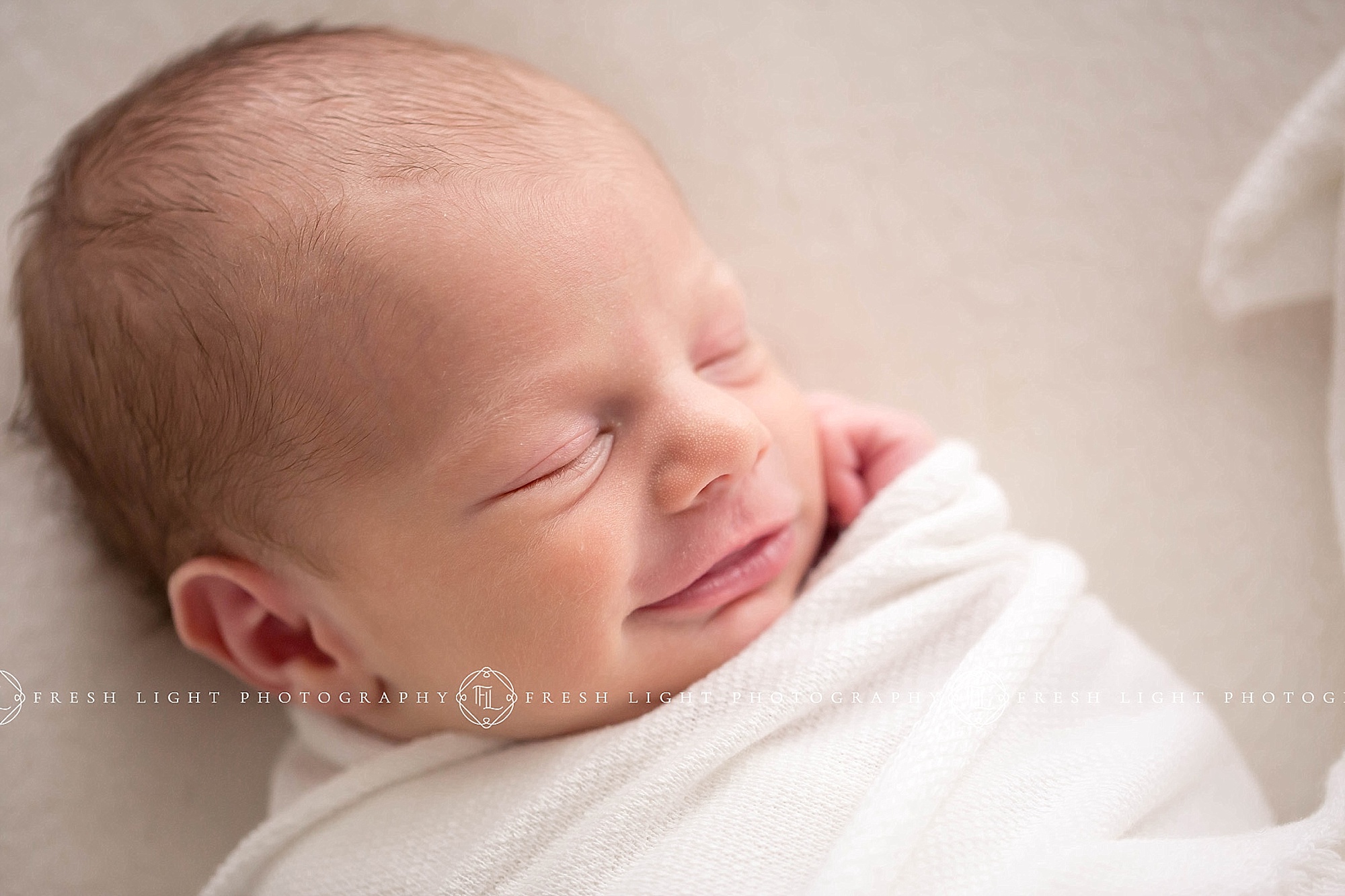 newborn boy smiling for fresh light photography in houston