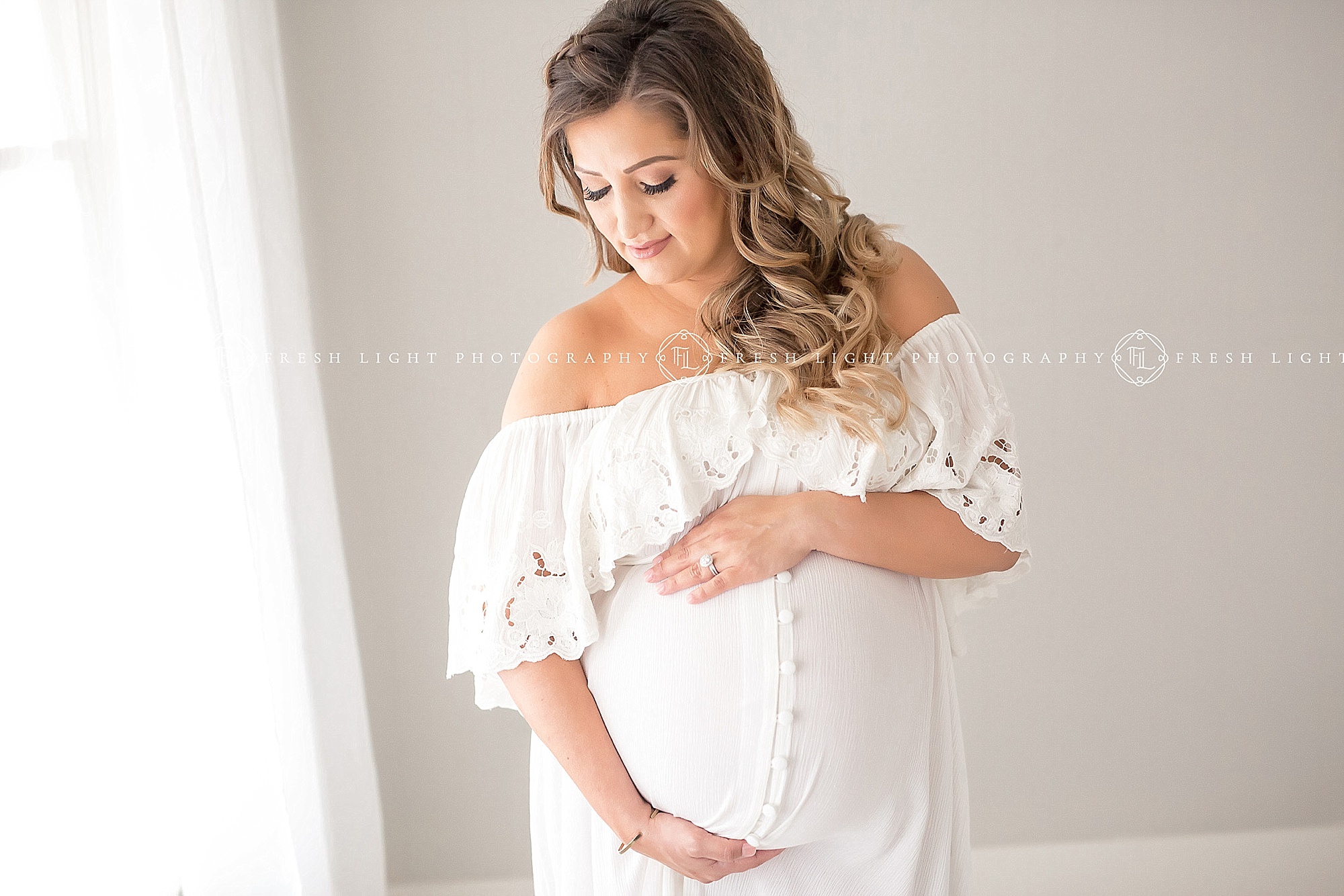 Pearland pregnant mom wearing white dress