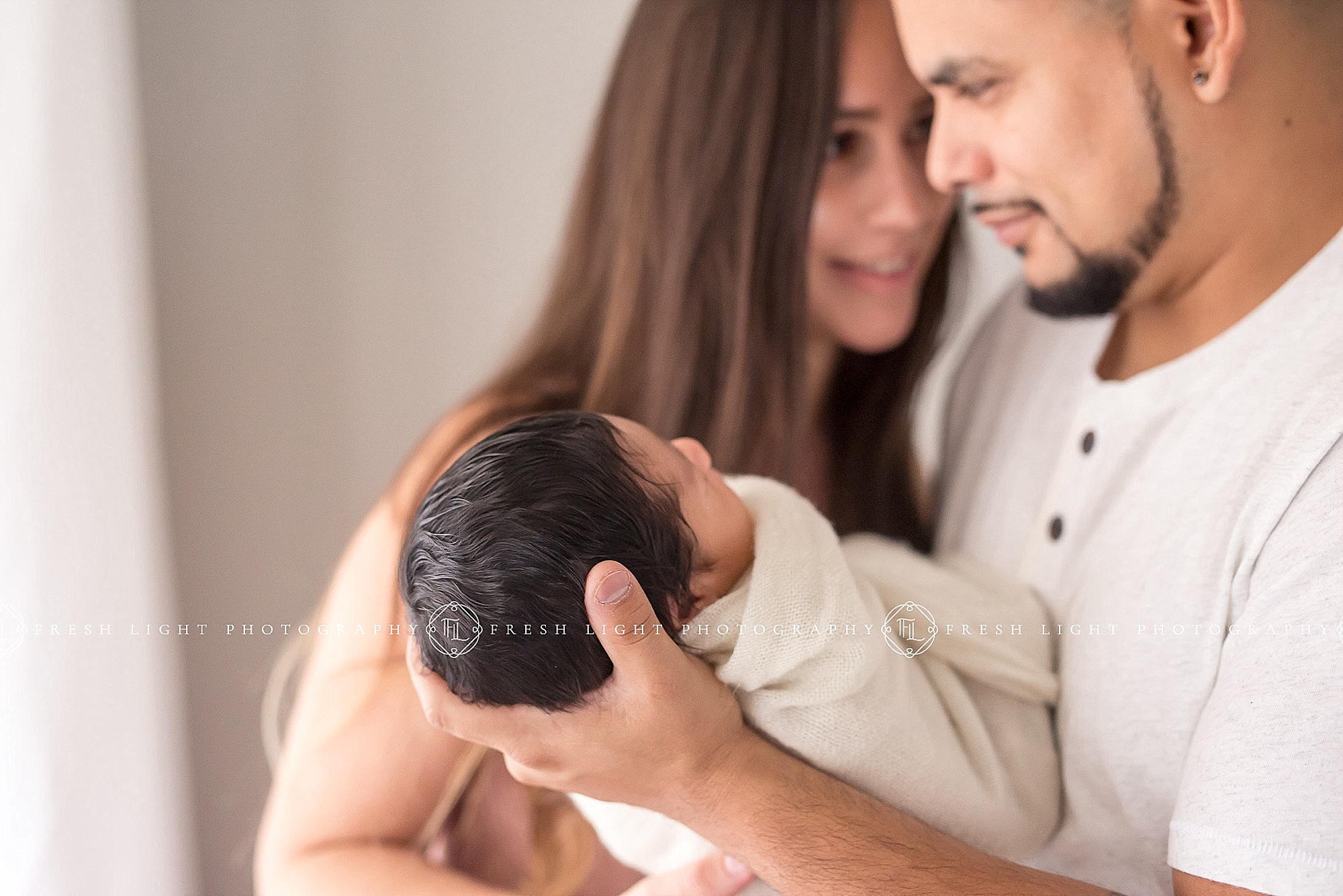 Houston Couple with newborn baby during natural light photo session