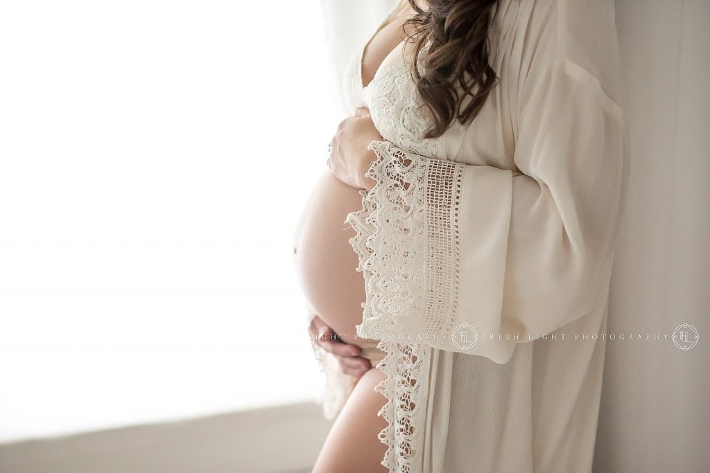 pregnant mom in lace robe having maternity pictures taken by fresh light photography