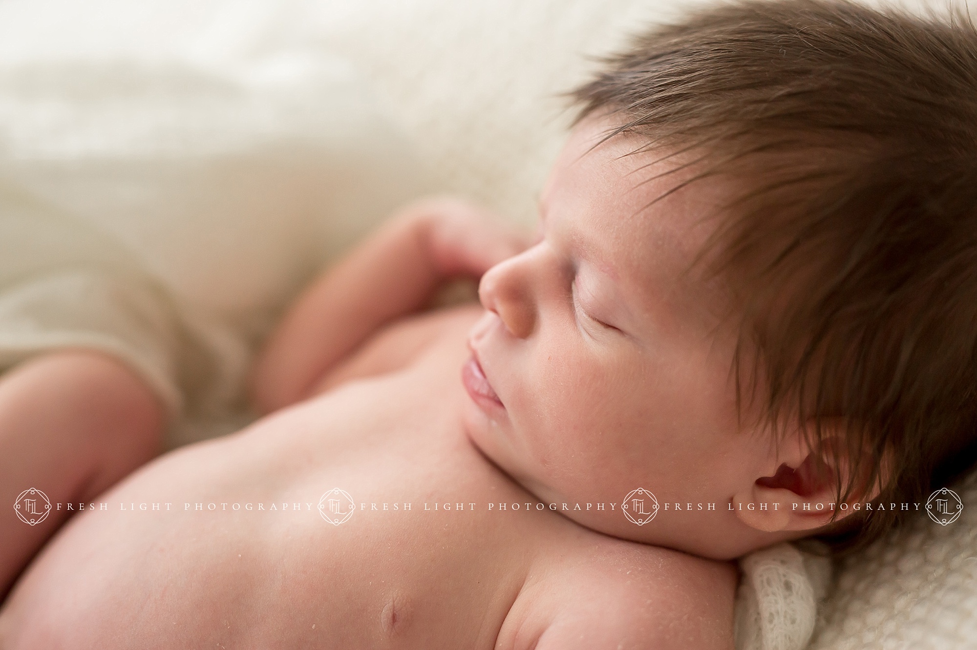 Baby girl in blanket in Houston Photography Studio