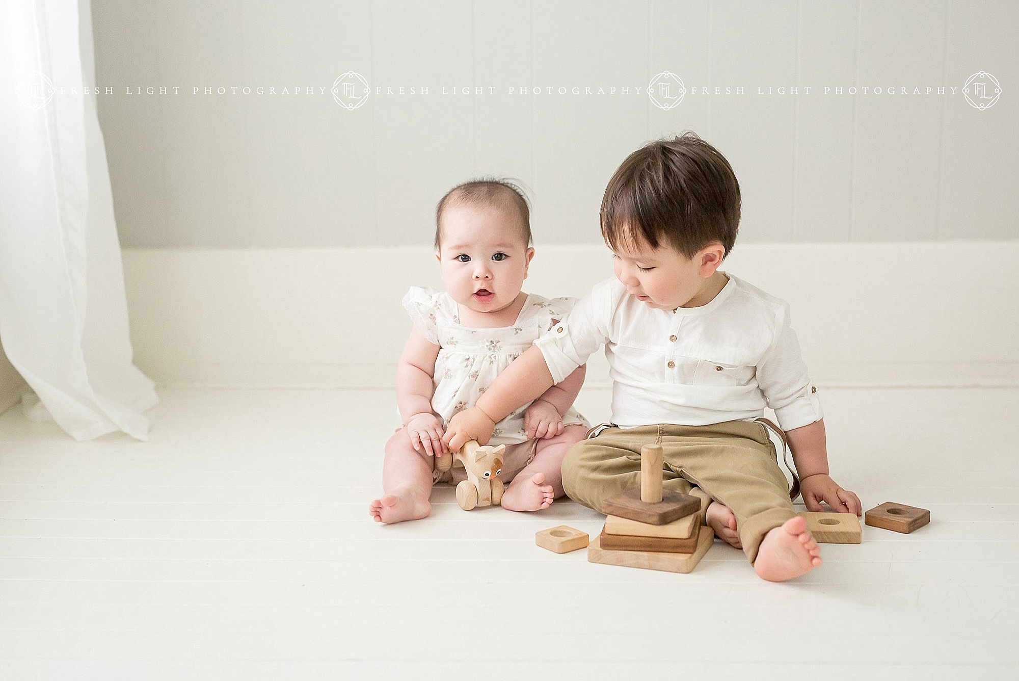 Children playing with toys in Houston Photography Studio