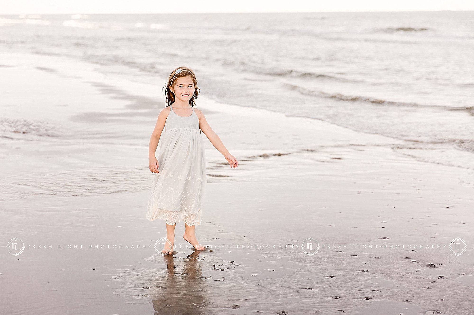 Daughter standing on the beach