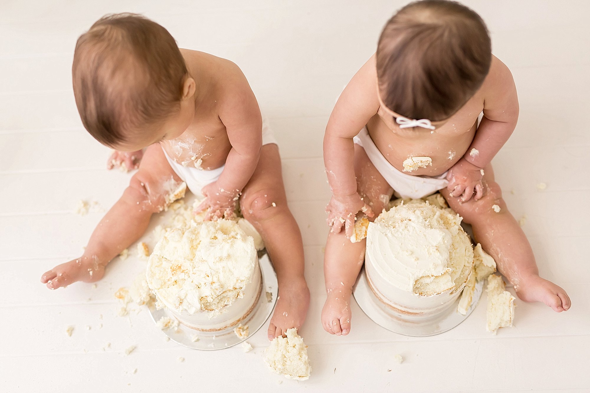 twins eating birthday cake