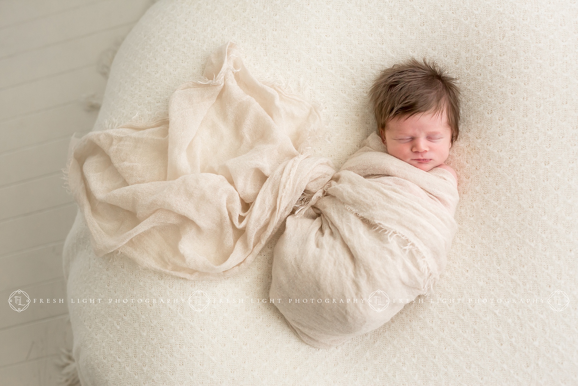 Baby girl in blanket in Houston Photography Studio