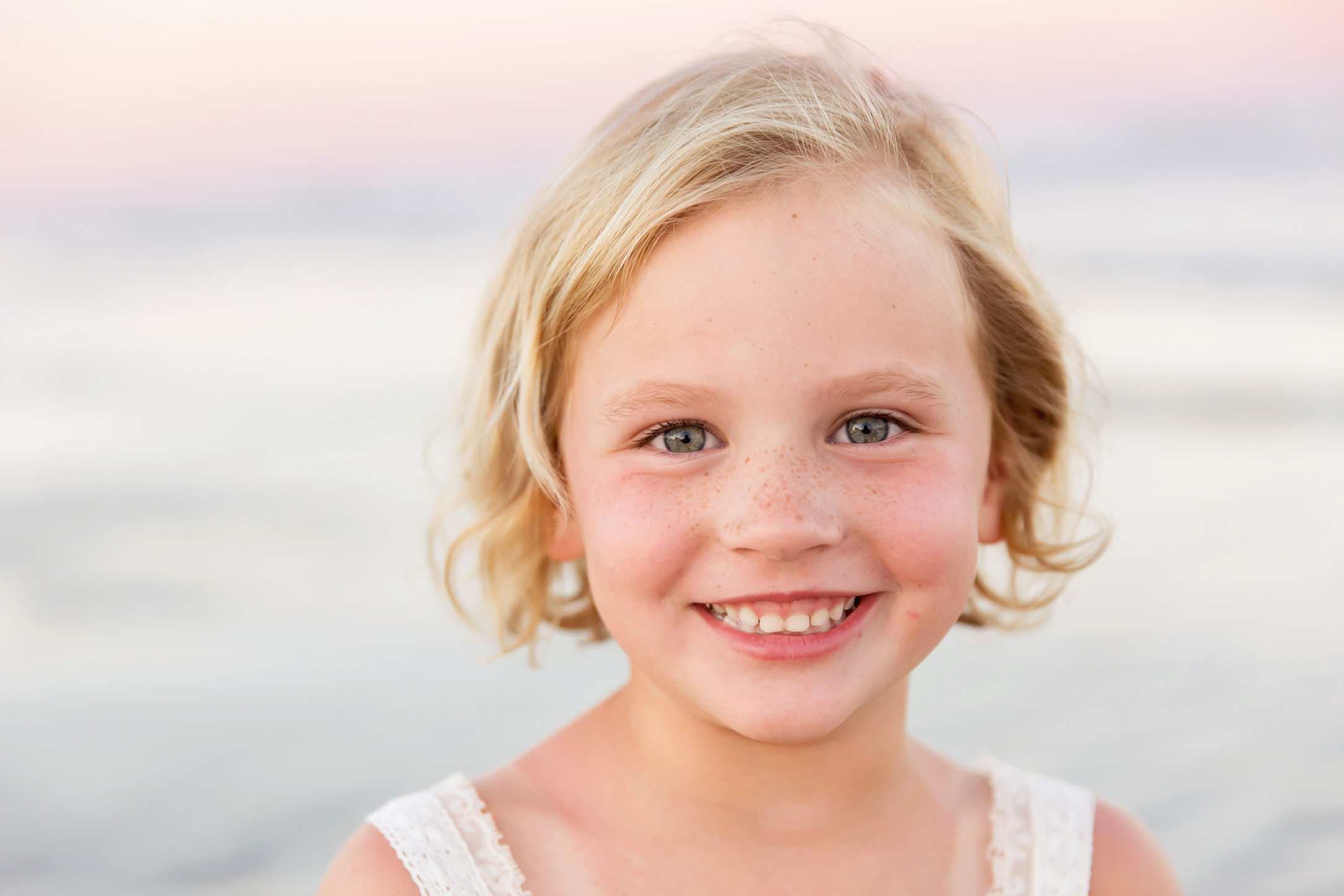 blonde girl with freckles on Galveston beach