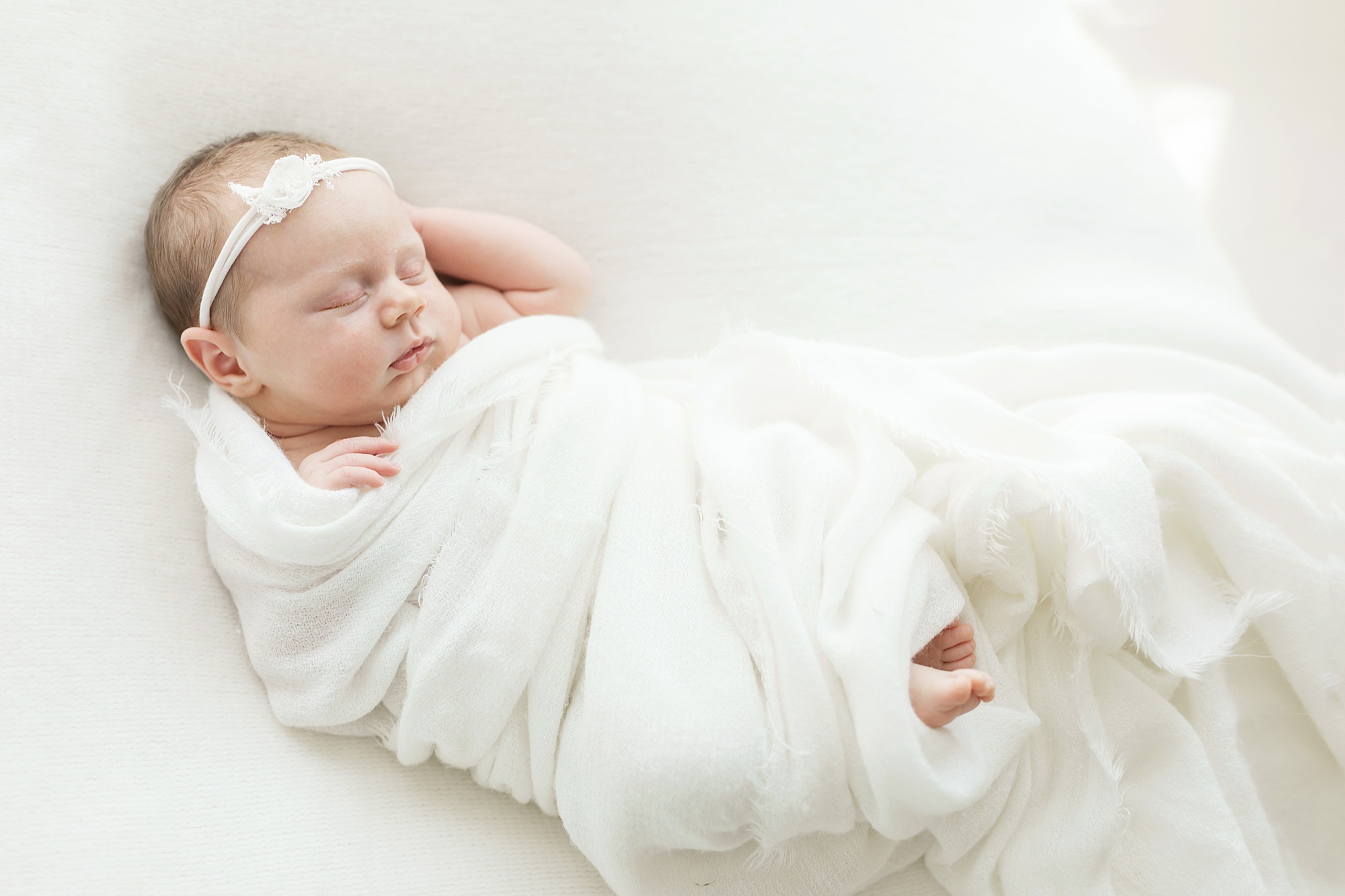 wrapped newborn posing in Houston photography session