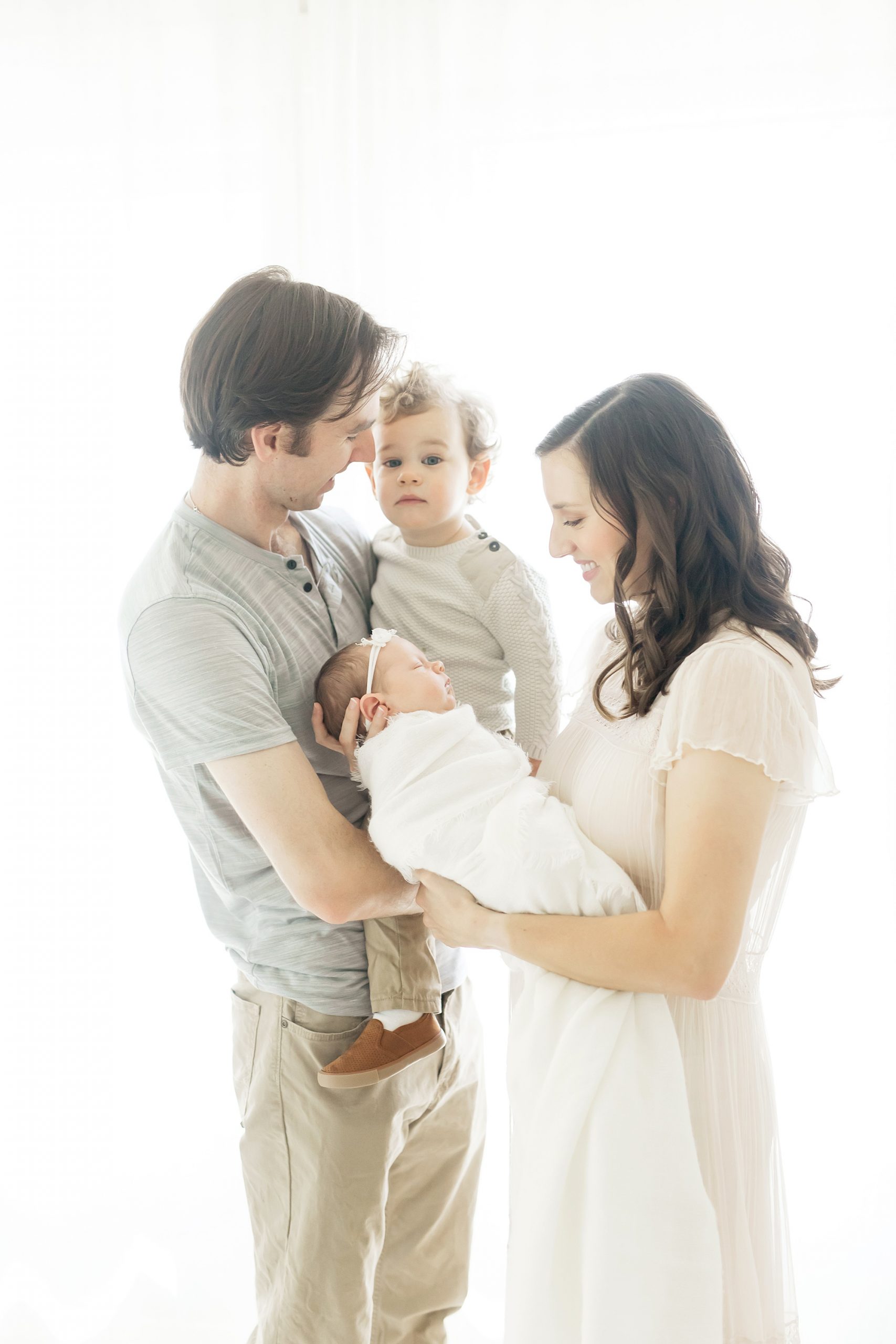 family pictures during newborn session in the heights