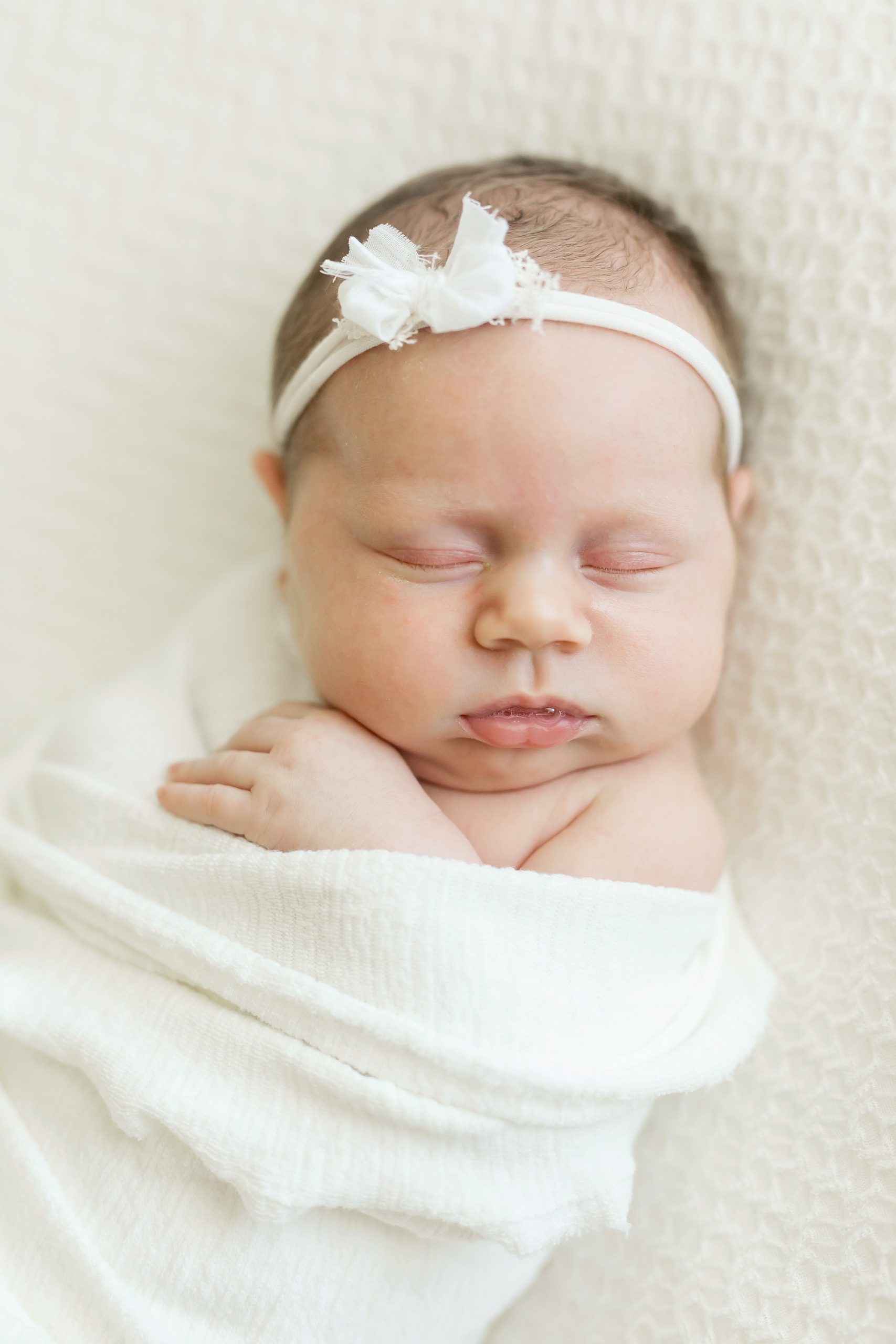 baby girl posed for newborn photos in Houston