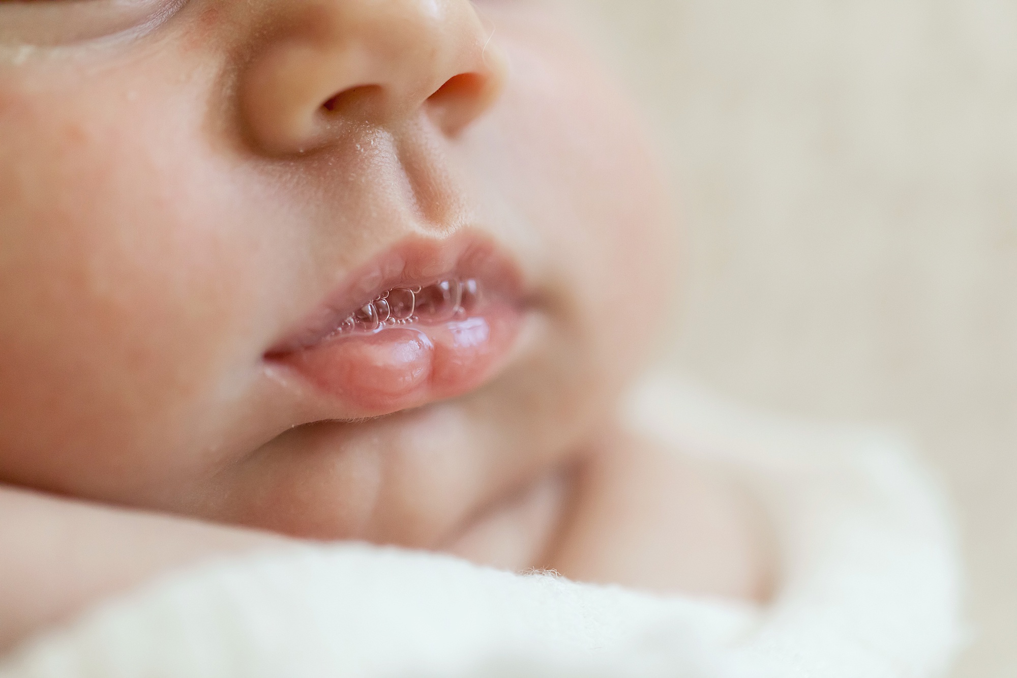 newborn lips with spit bubbles