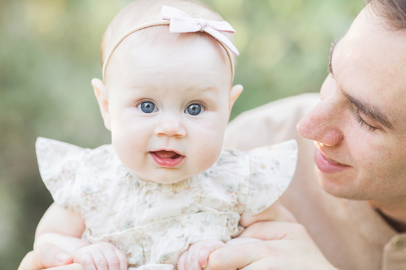 Baby girl with big blue eyes with her Daddy. Photos by Fresh Light Photography..