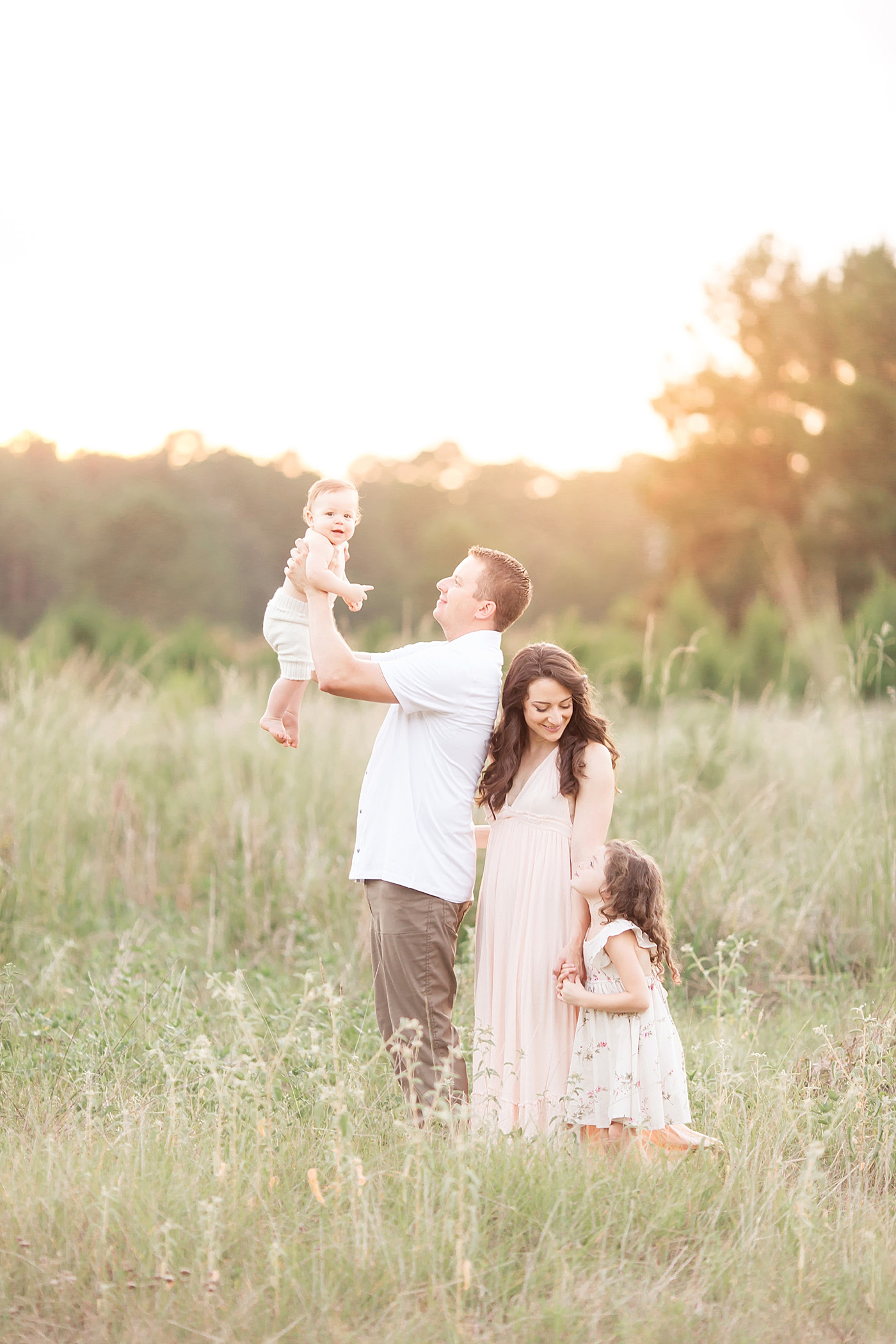 Outdoor family session for baby's six month photoshoot with Fresh Light Photography.