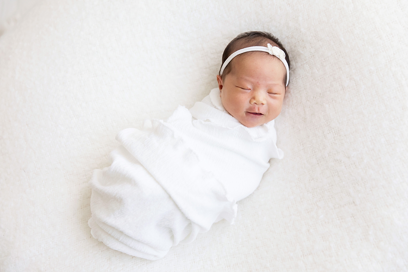 newborn baby girl swaddled in white | Fresh Light Photography