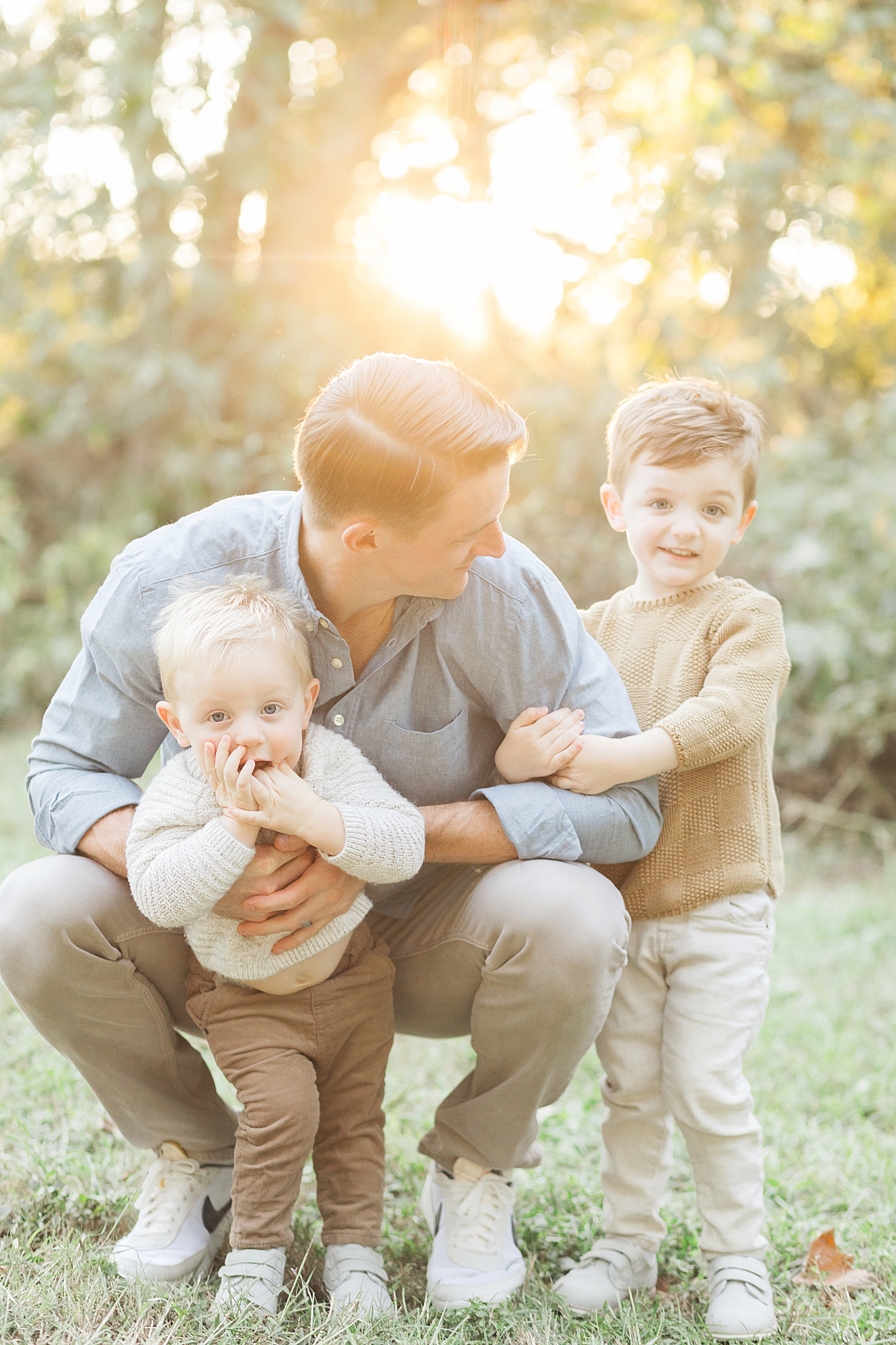 Photo of Dad and his two sons. Photo by Fresh Light Photography