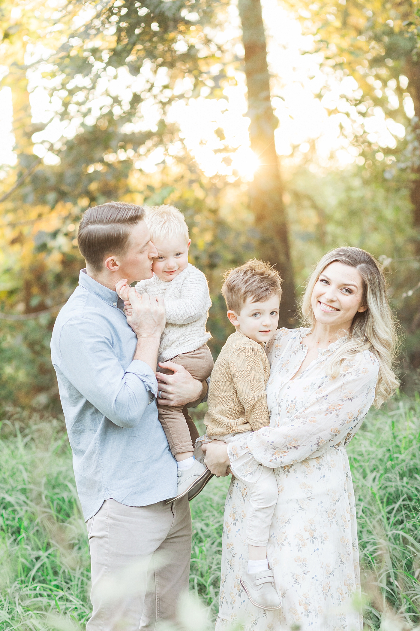 Family session in a field in The Heights at sunset. Photo by Fresh Light Photography