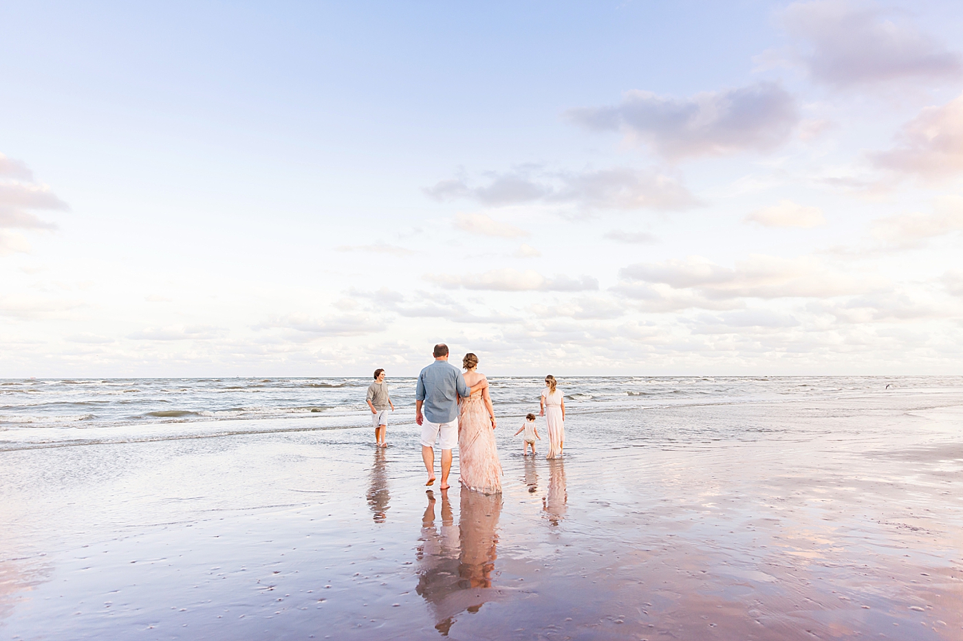 Sunset family photoshoot at Galveston Beach with Fresh Light Photography.