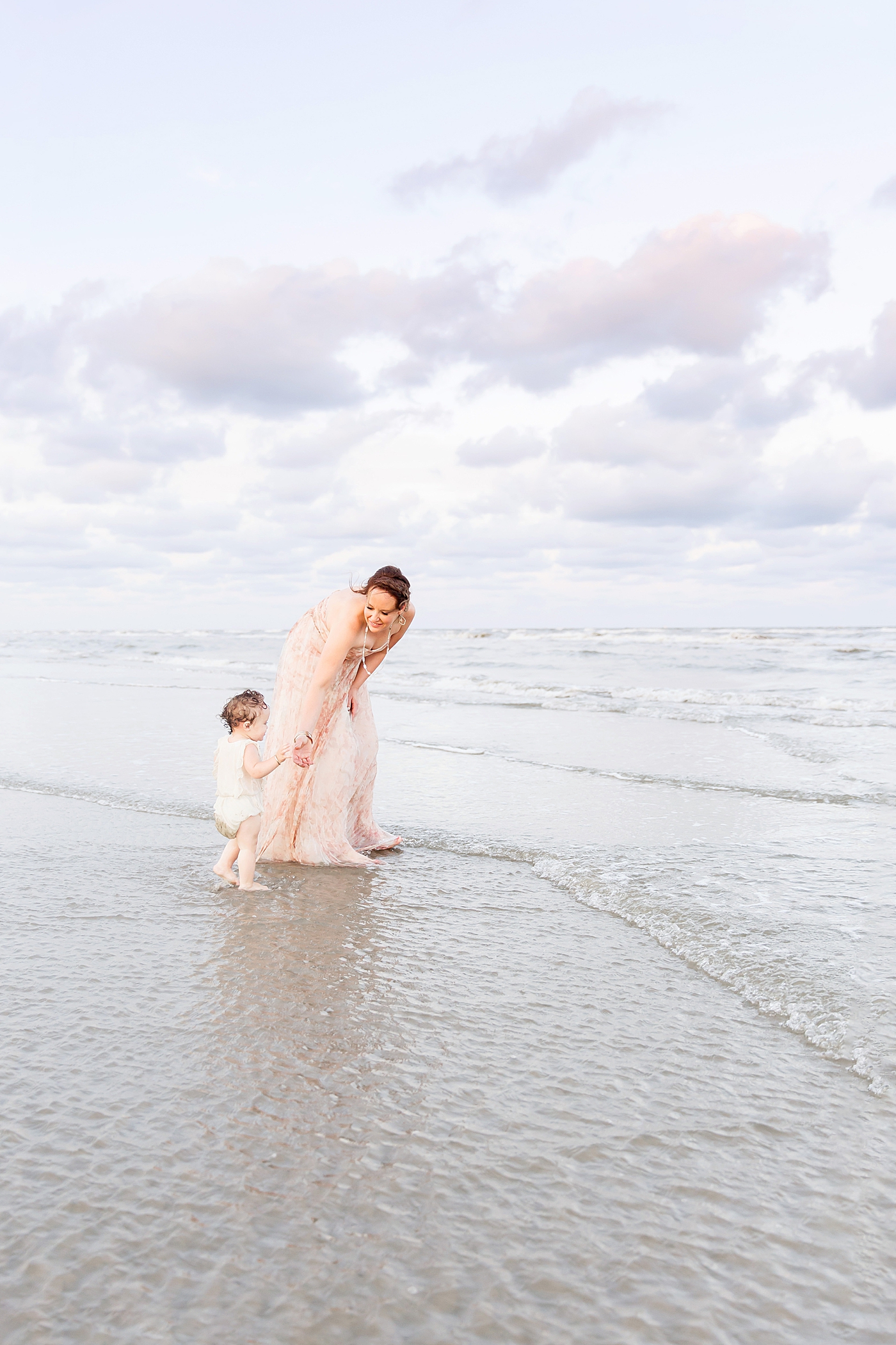 Mom and daughter on the beach. Photo by Fresh Light Photography.
