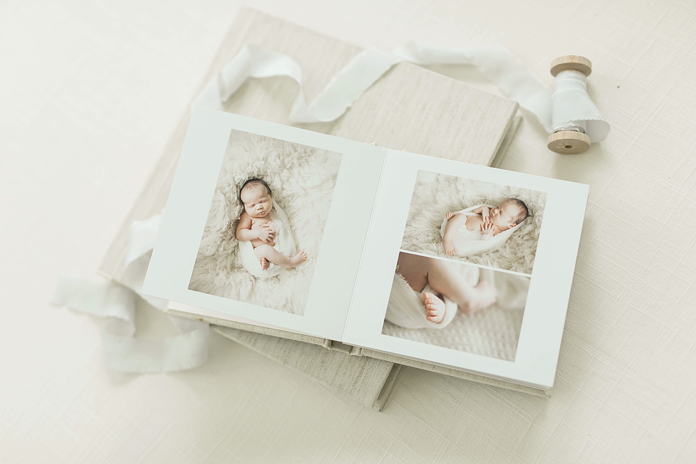 Fresh Light Photography designs beautiful album during design and ordering appointment with newborn client.