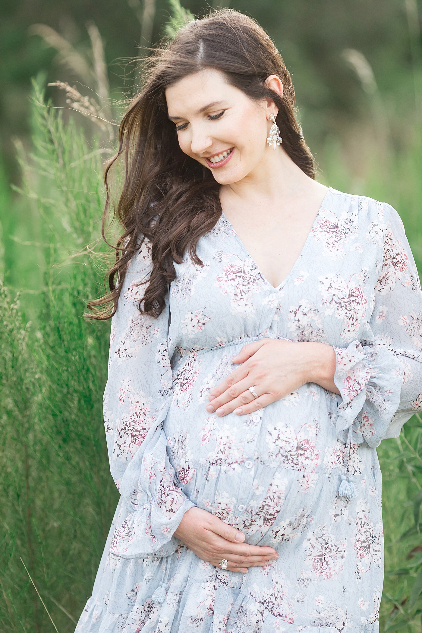 Mom in blue floral dress for maternity photoshoot in Houston with Fresh Light Photography.