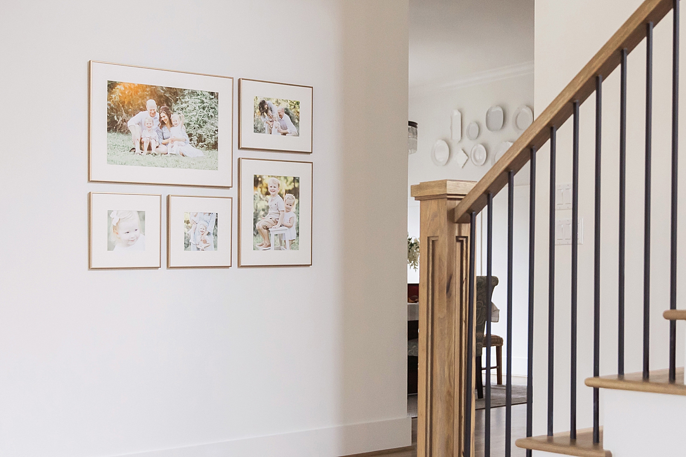 Custom gallery wall and framing in Houston home. Photo by Fresh Light Photography.