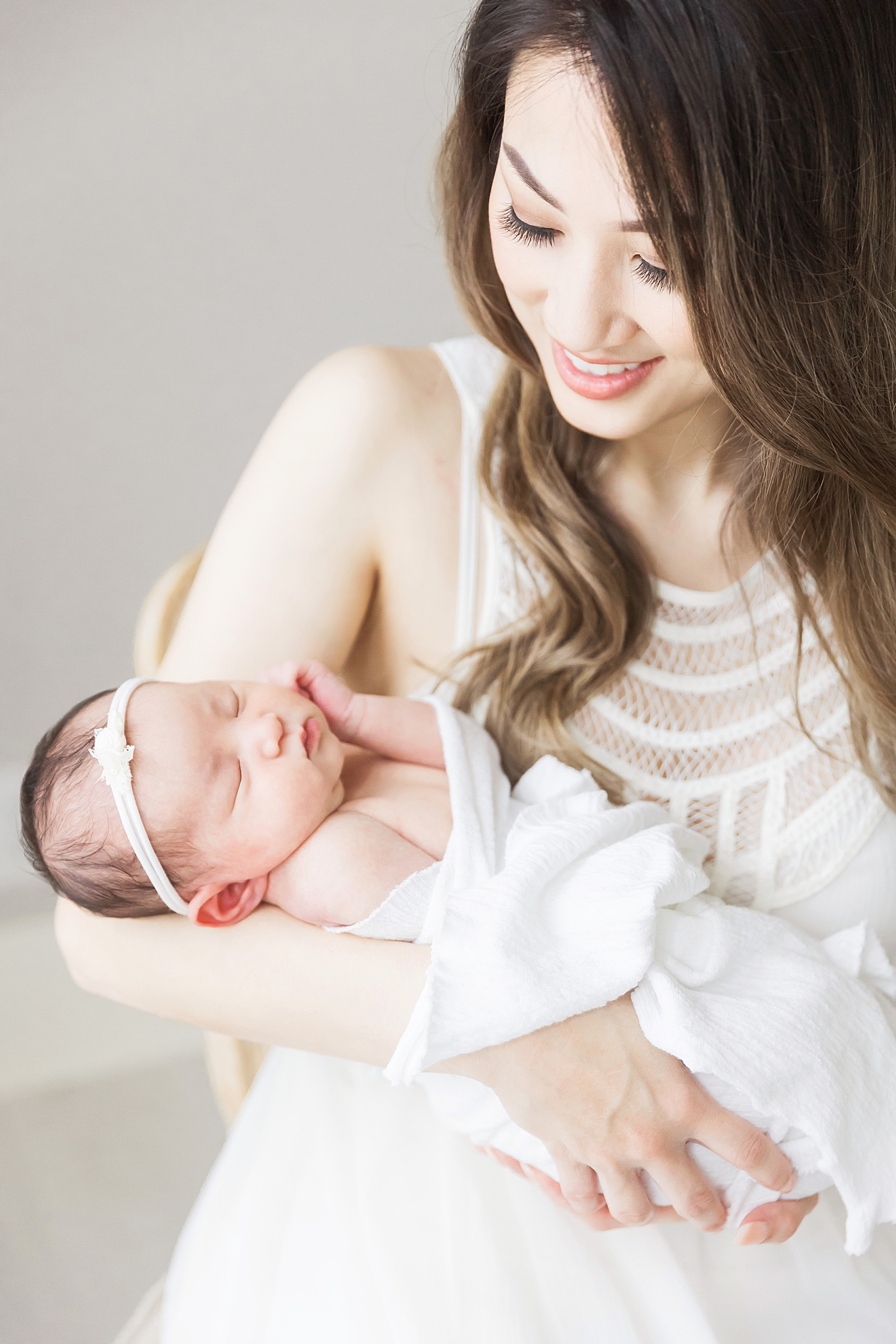 Mom and newborn baby girl. Professional newborn photography by Fresh Light Photography.