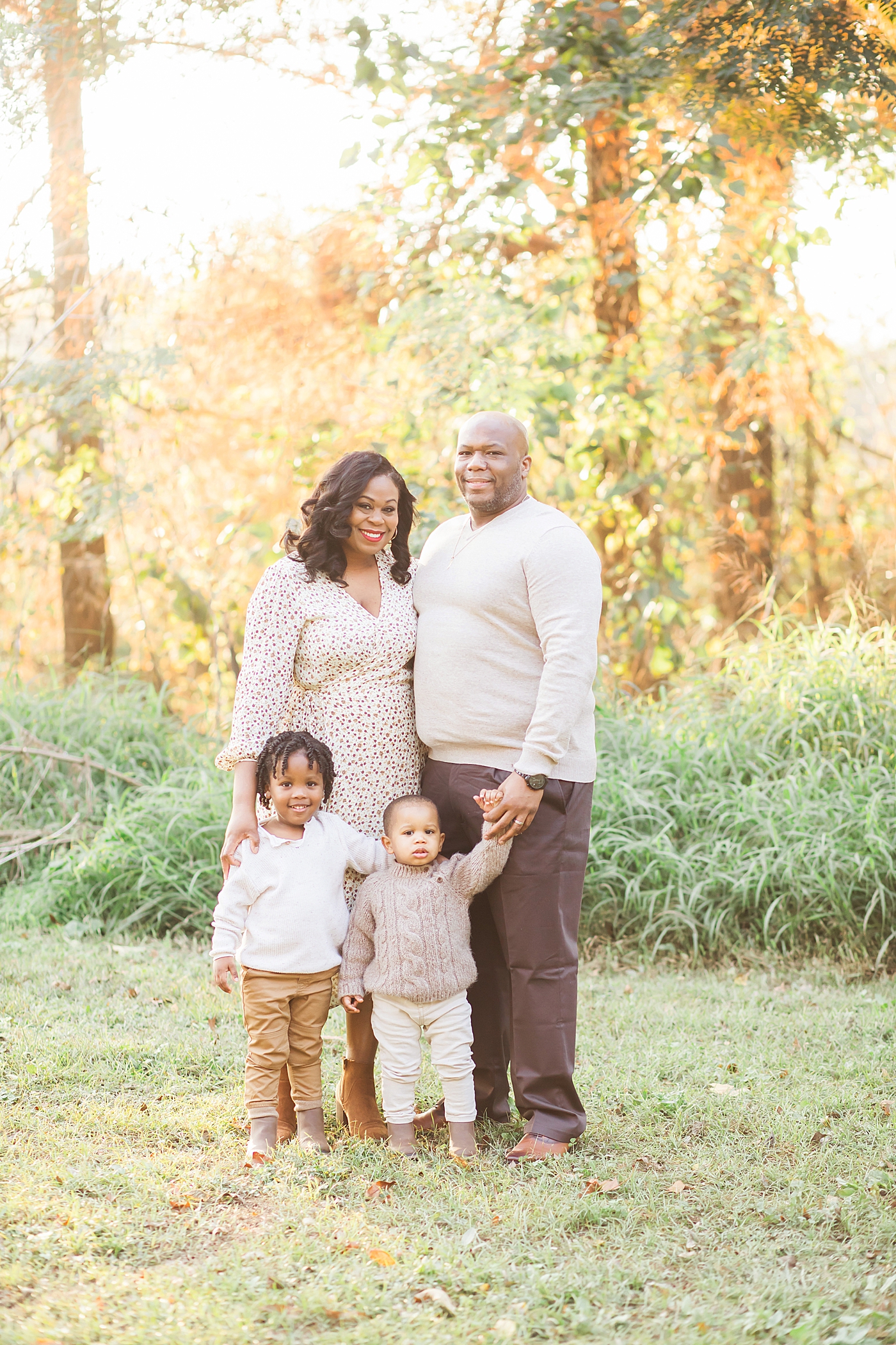 Family looking and smiling for family portraits. Photo by Fresh Light Photography.