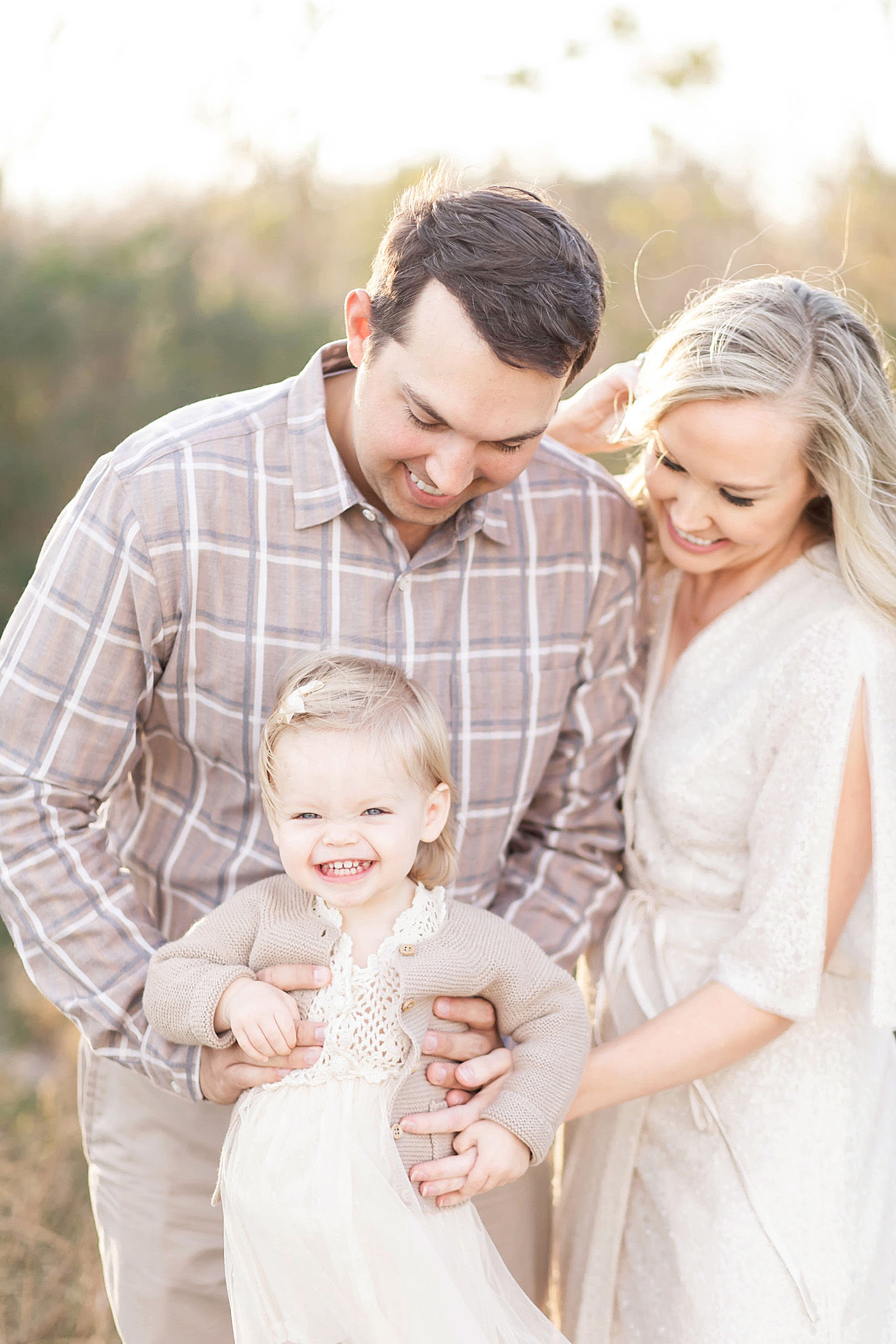 Mom, Dad and toddler daughter. Photo by Fresh Light Photography.