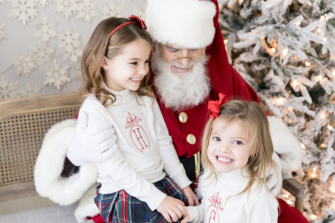 Two sisters visit with Santa in Houston Heights with Fresh Light Photography.