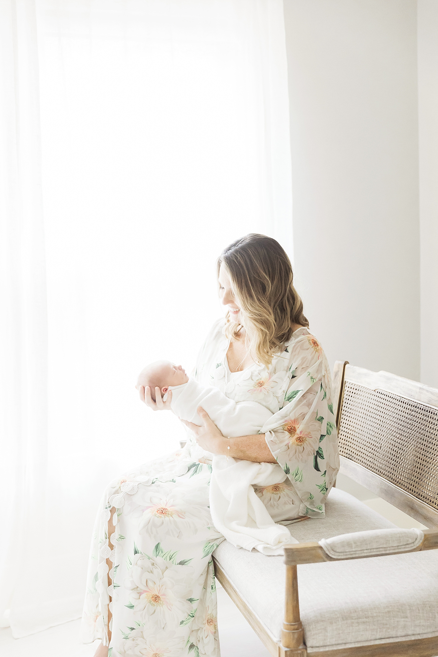 Mom holding her baby boy during newborn session with Houston Photographer, Fresh Light Photography.