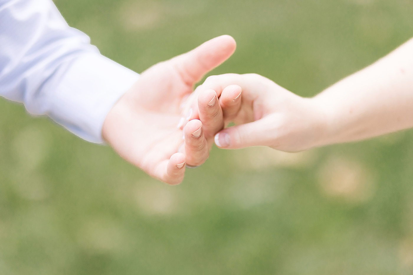 Couple holding hands. Photo by Fresh Light Photography.