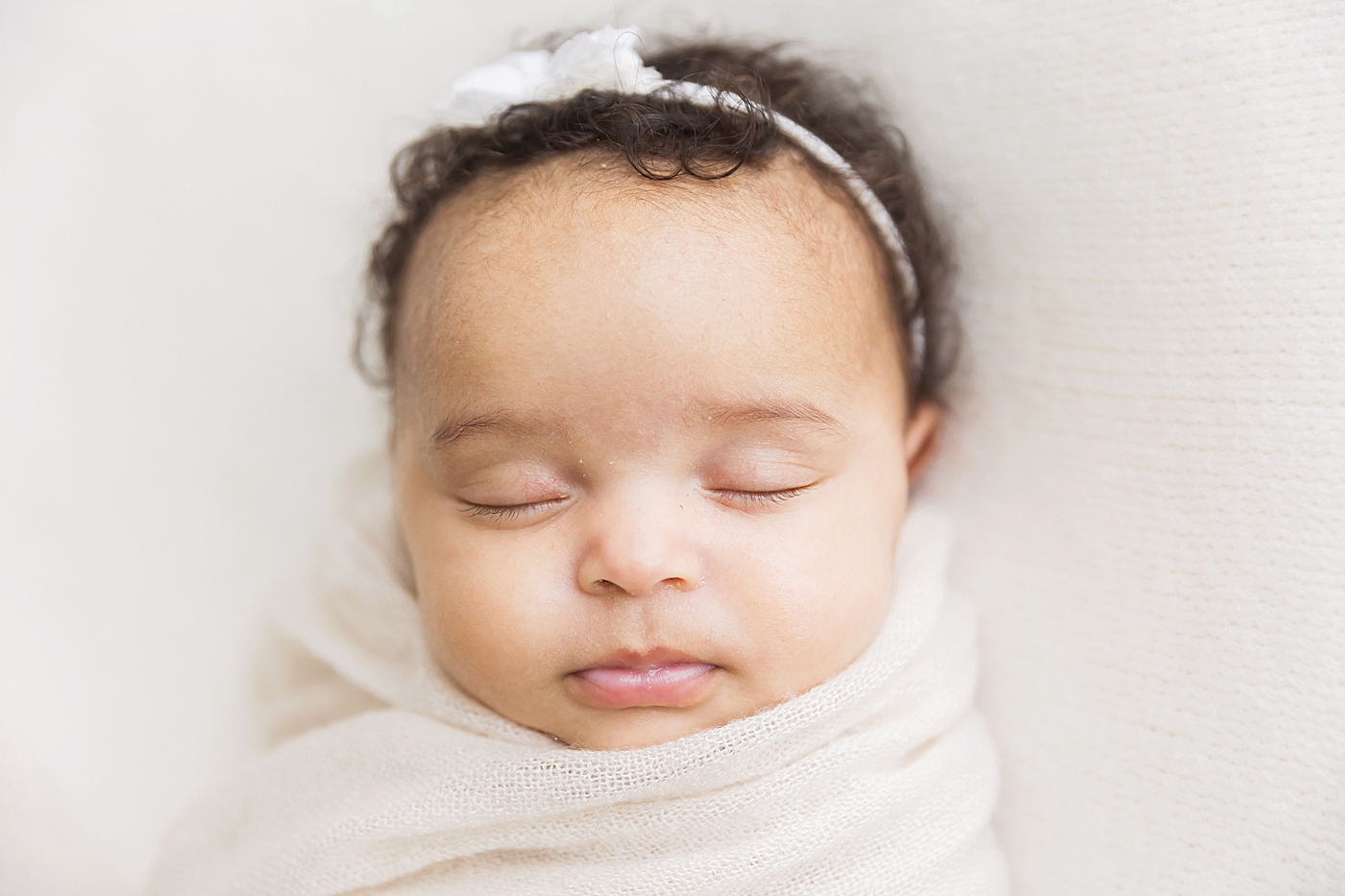 Baby girl sleeping for newborn photos at six weeks old in studio with Fresh Light Photography.