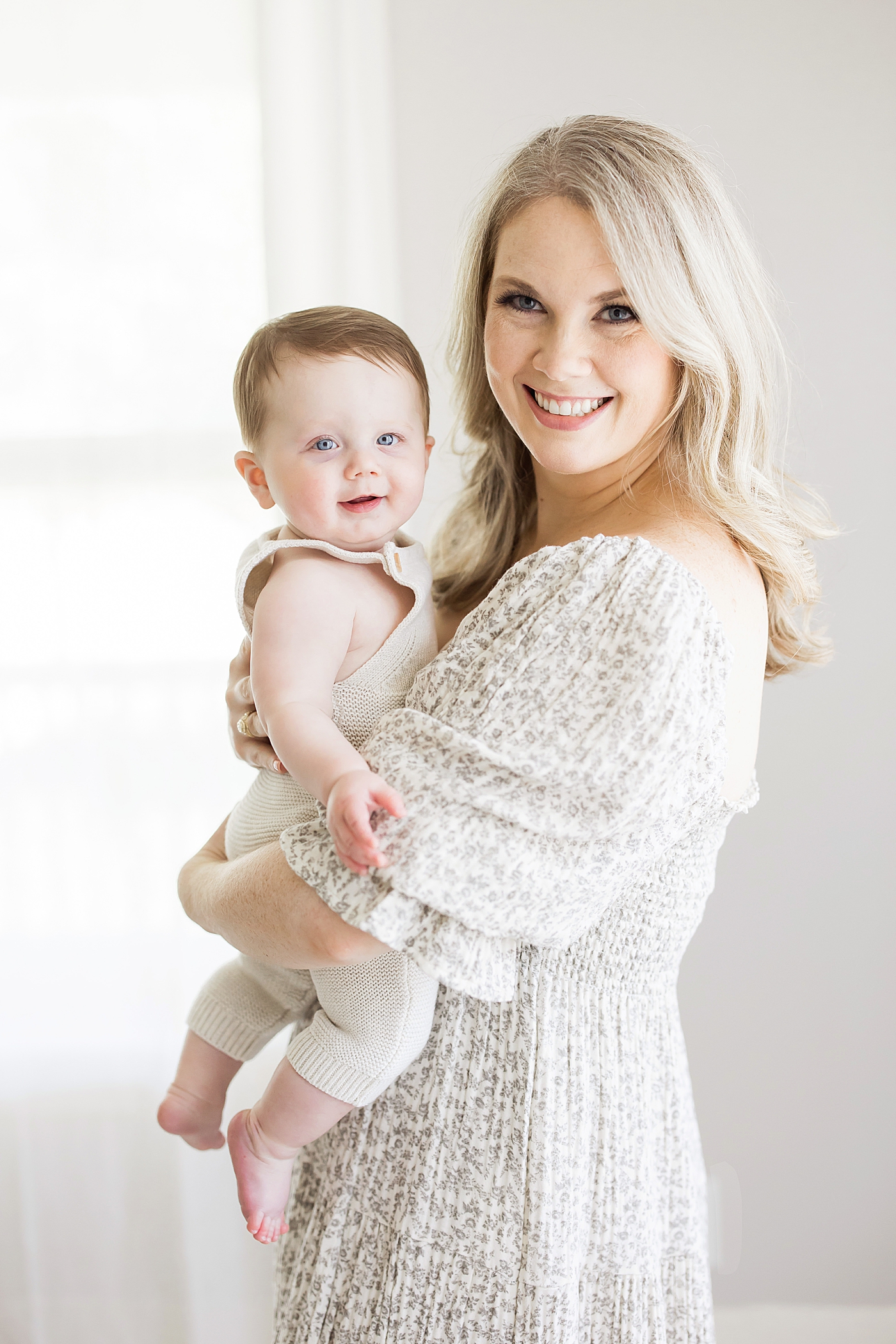 Mom holding son for photos in studio in Houston. Photo by Fresh Light Photography