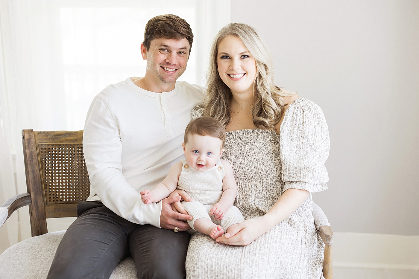 Mom and Dad with their six month old baby boy for milestone session in the studio with Fresh Light Photography.