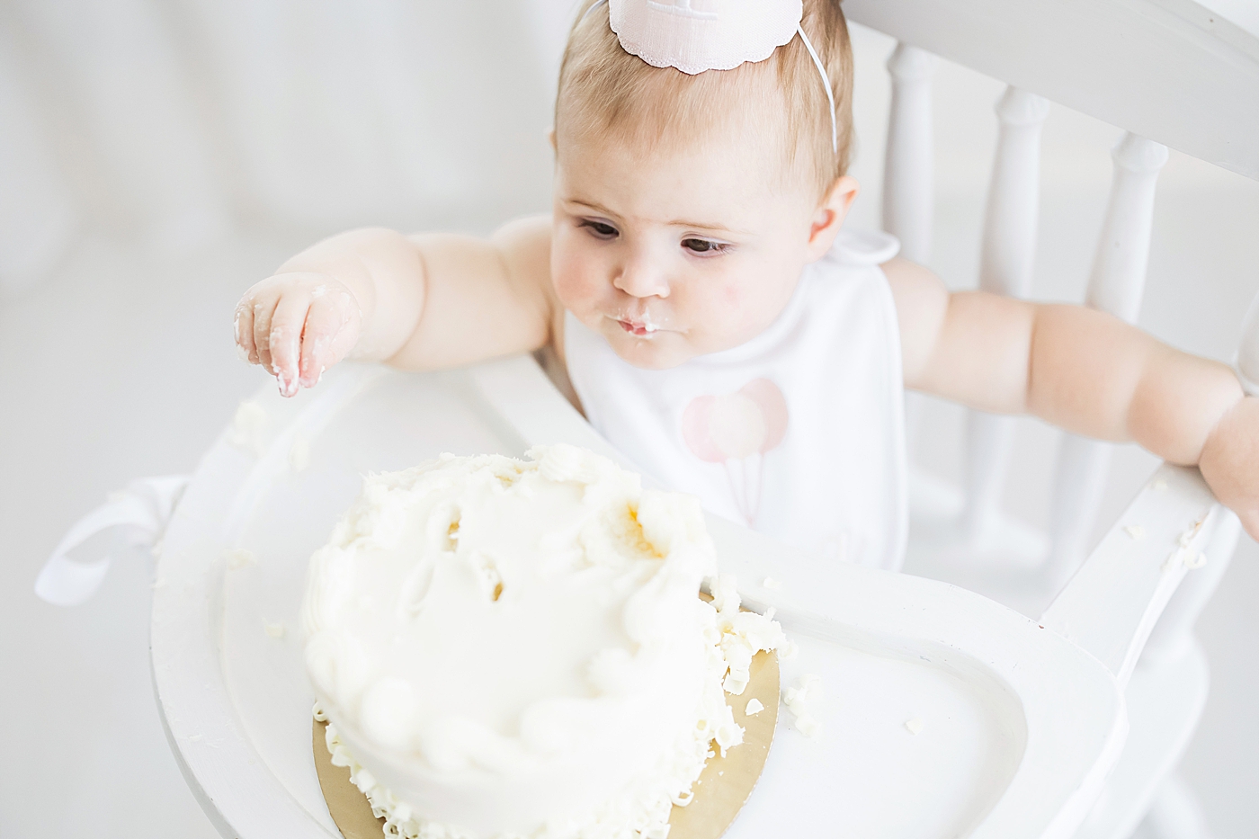 One year old photoshoot with cake smash in Houston studio. Photo by Fresh Light Photography.