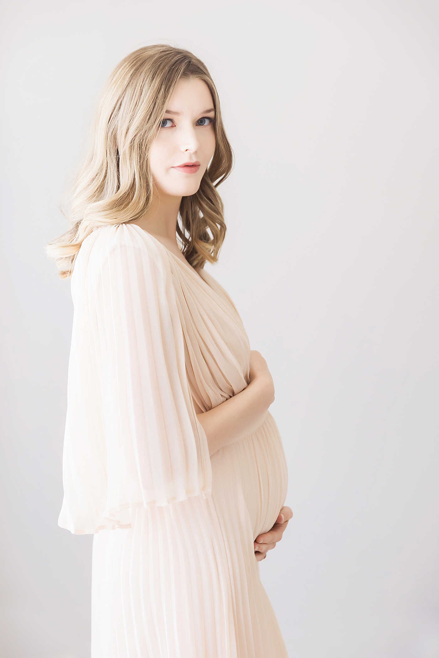 Expecting mom in beautiful dress. Photo by Fresh Light Photography.