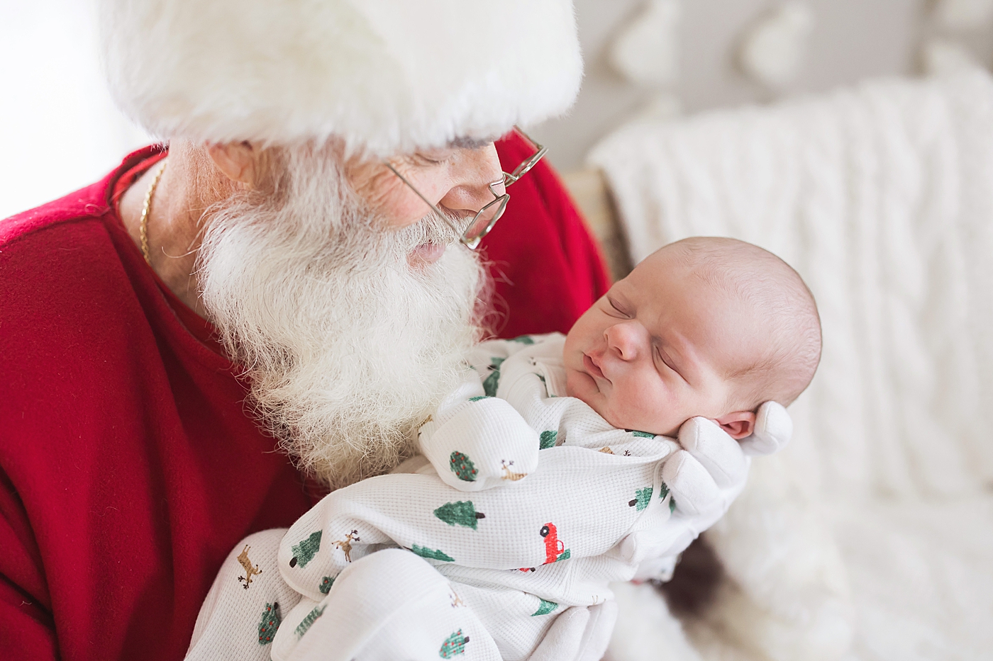 Santa holding newborn baby. Photo by Fresh Light Photography.
