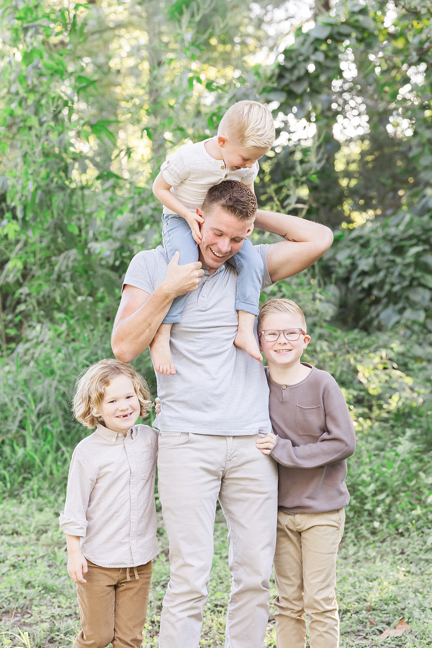 Dad and three boys together with youngest on his shoulders. Photo by Fresh Light Photography