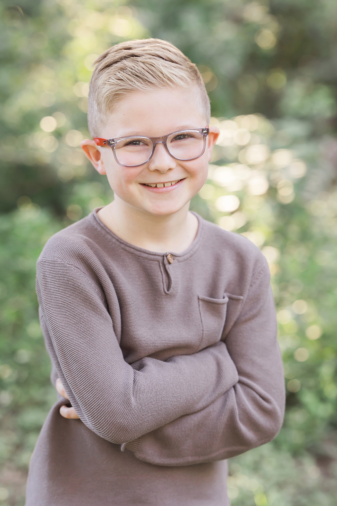 Portrait of young boy with glasses. Photo by Fresh Light Photography