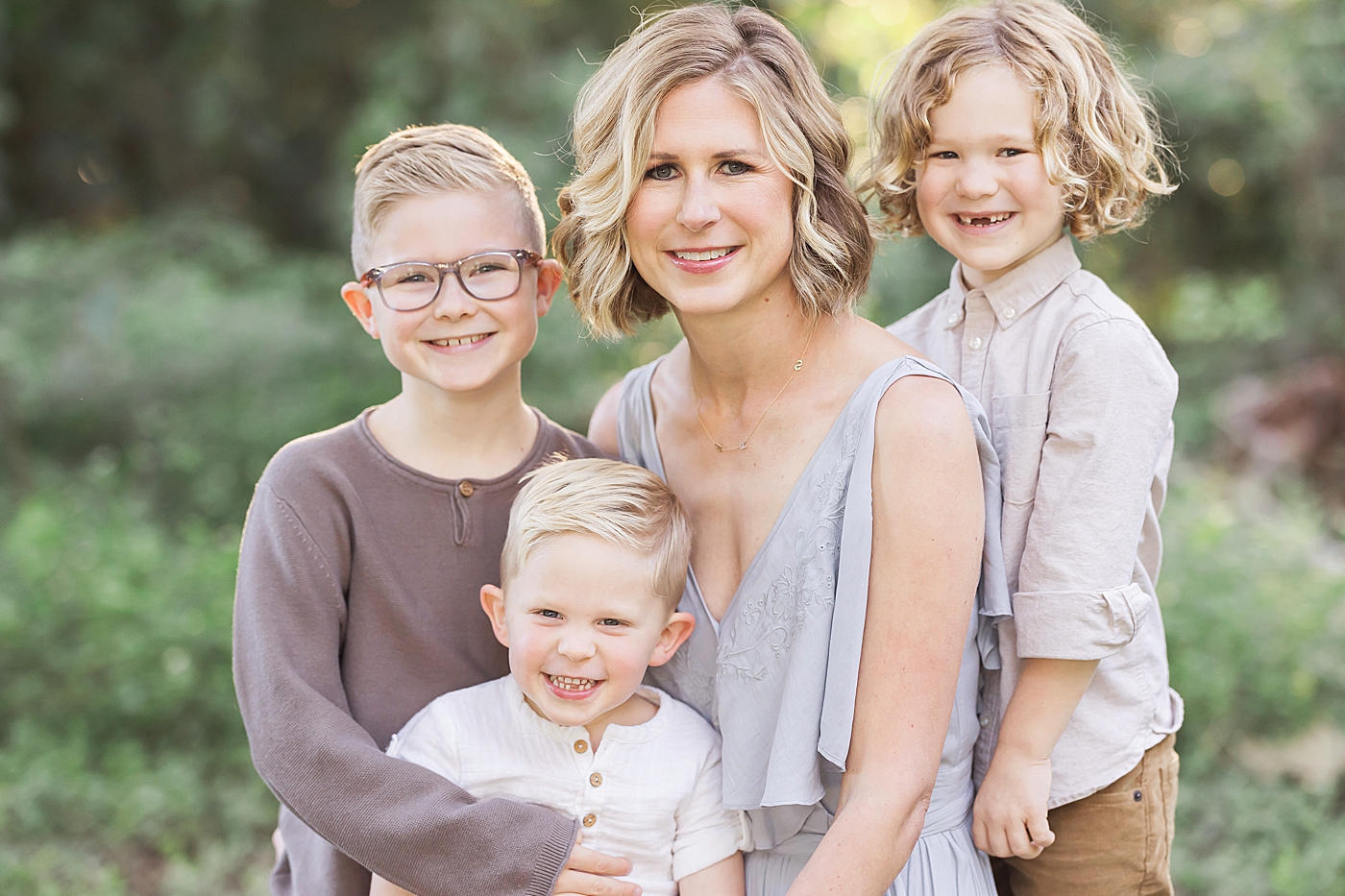 Mom with her three boys. Photo by Fresh Light Photography