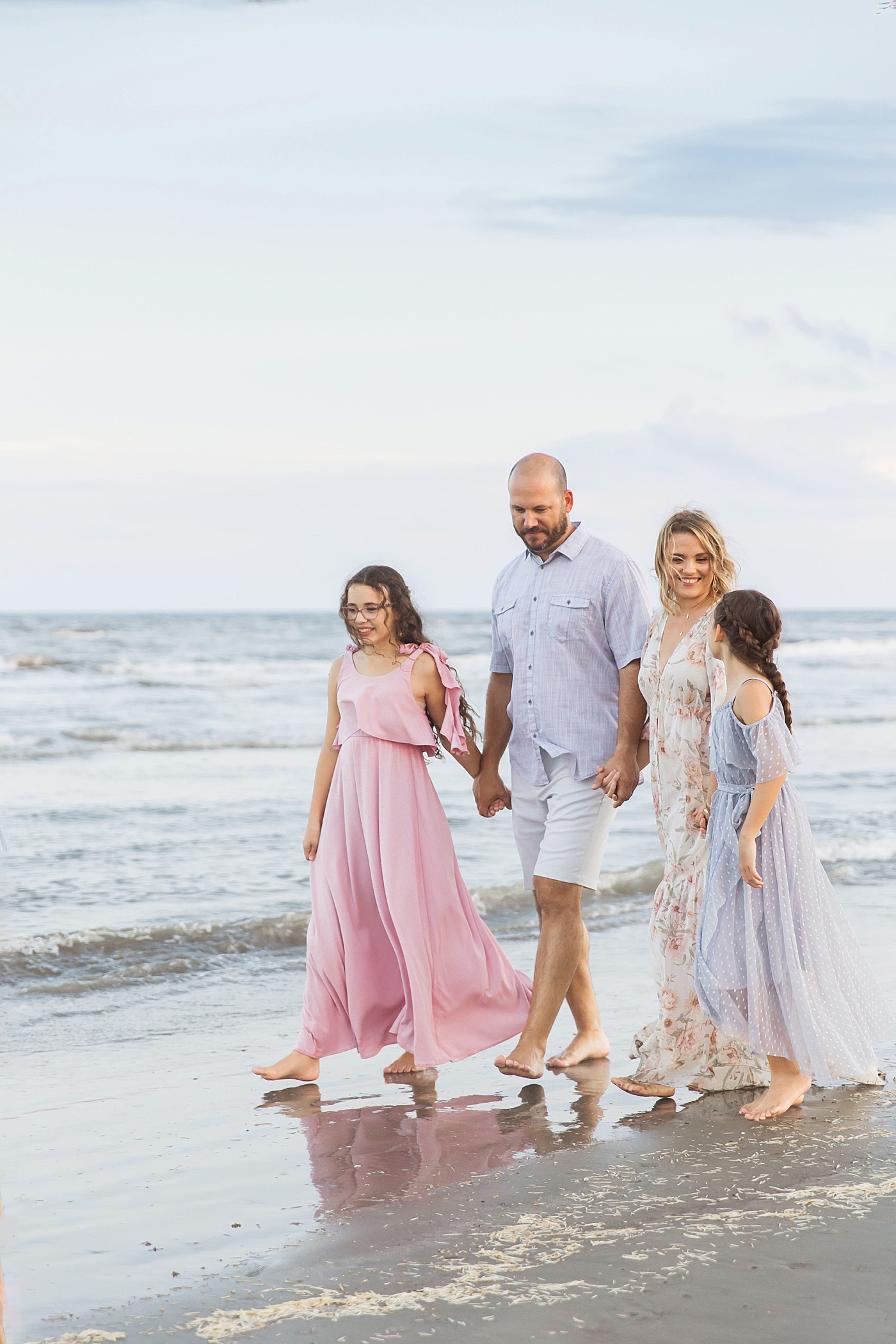 Family walking on the beach. Photo by Fresh Light Photography.