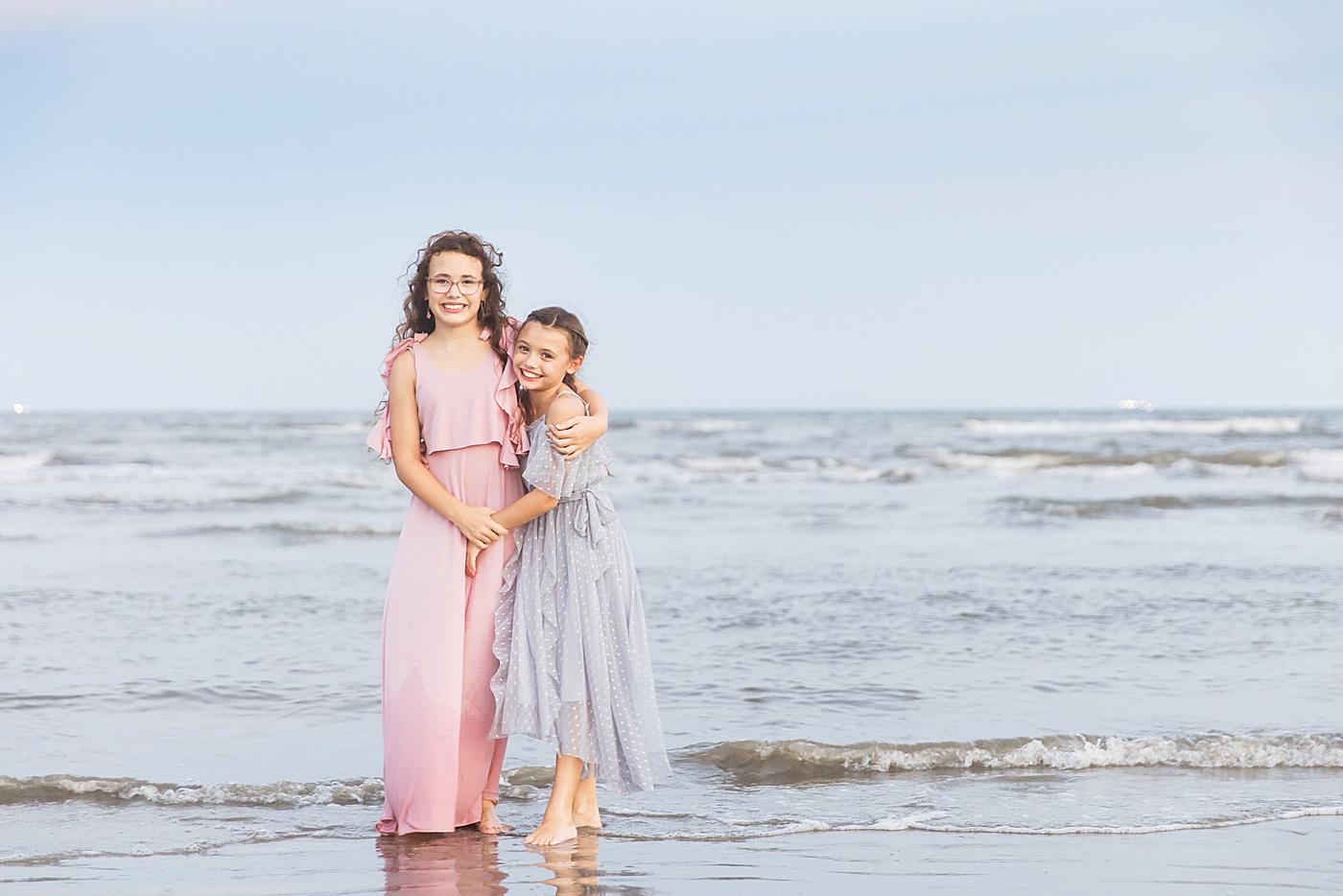 Sisters on the beach. Photo by Fresh Light Photography.
