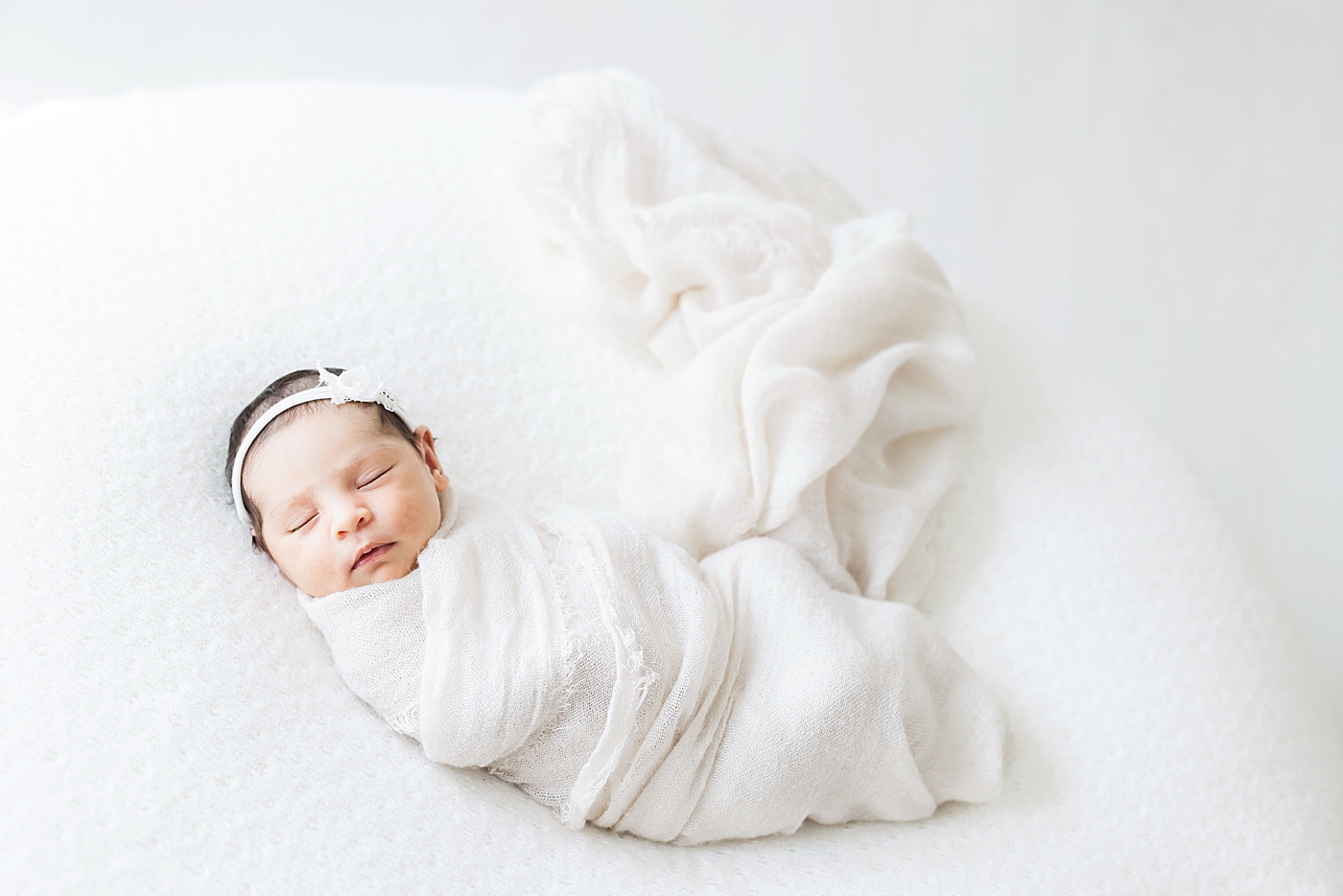 Baby girl swaddled | Photo by Fresh Light Photography.