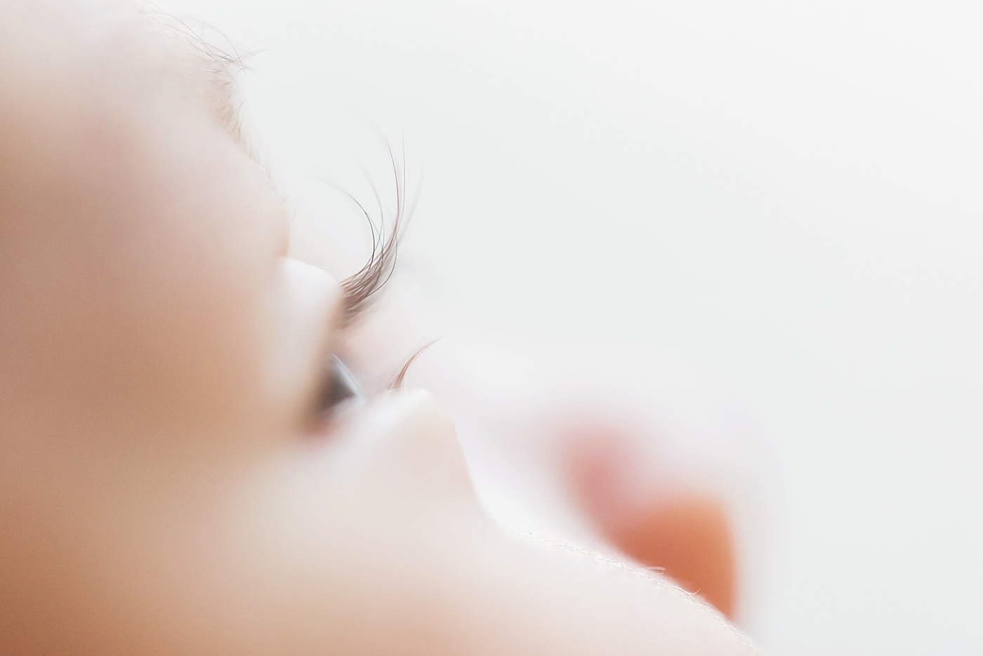 Detail photo of newborn baby's eyelashes. Photo by Fresh Light Photography.
