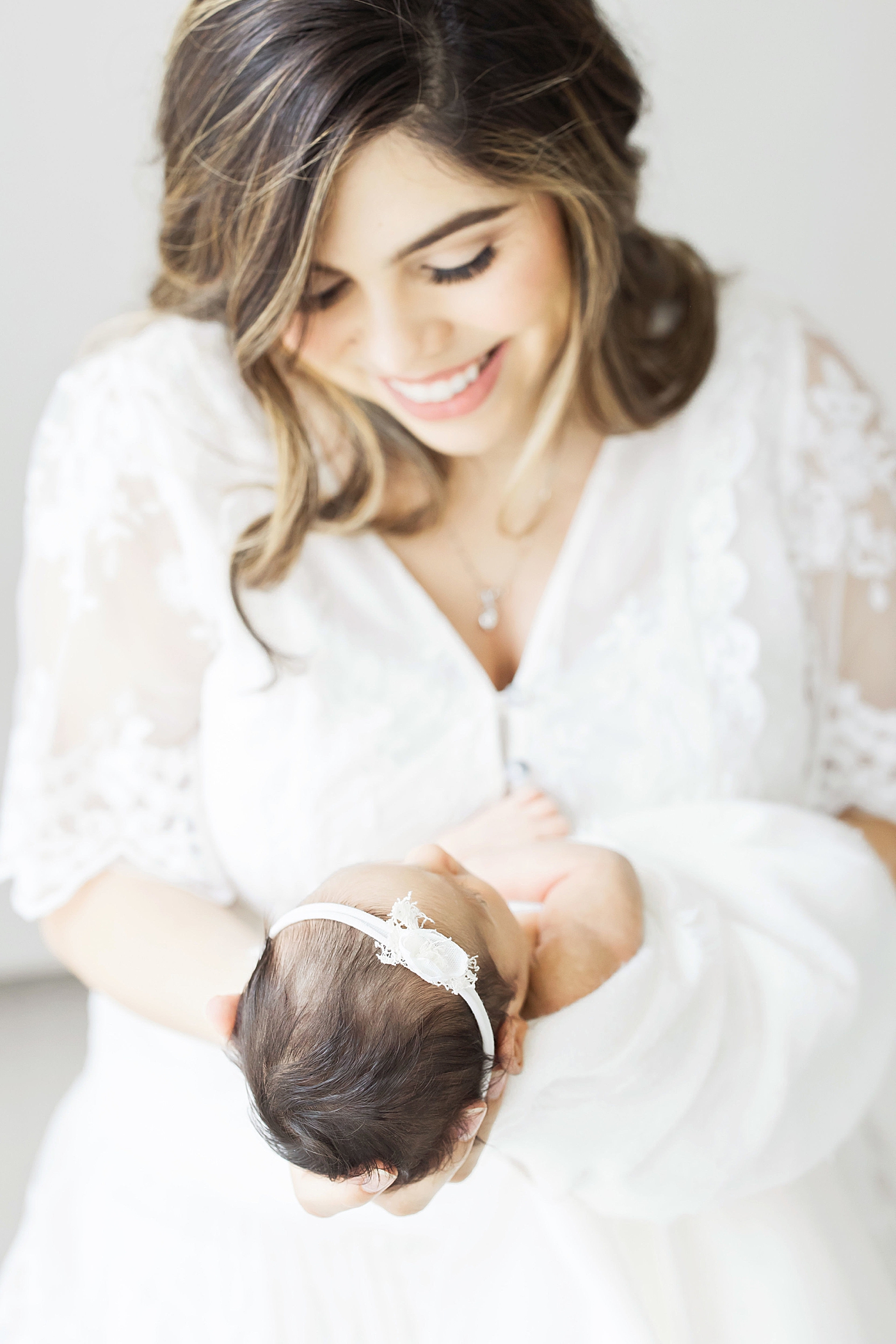 Mom with newborn baby girl. Photo by Fresh Light Photography.