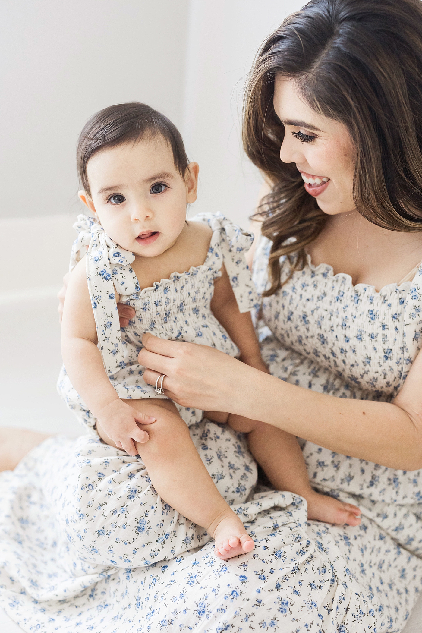 Mom and daughter wearing matching dresses for photos with Fresh Light Photography.