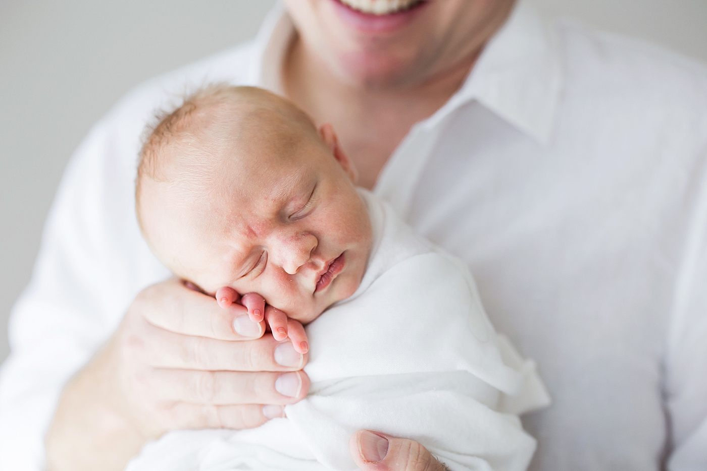 Father-son photos during studio newborn session in Houston. Photo by Fresh Light Photography.