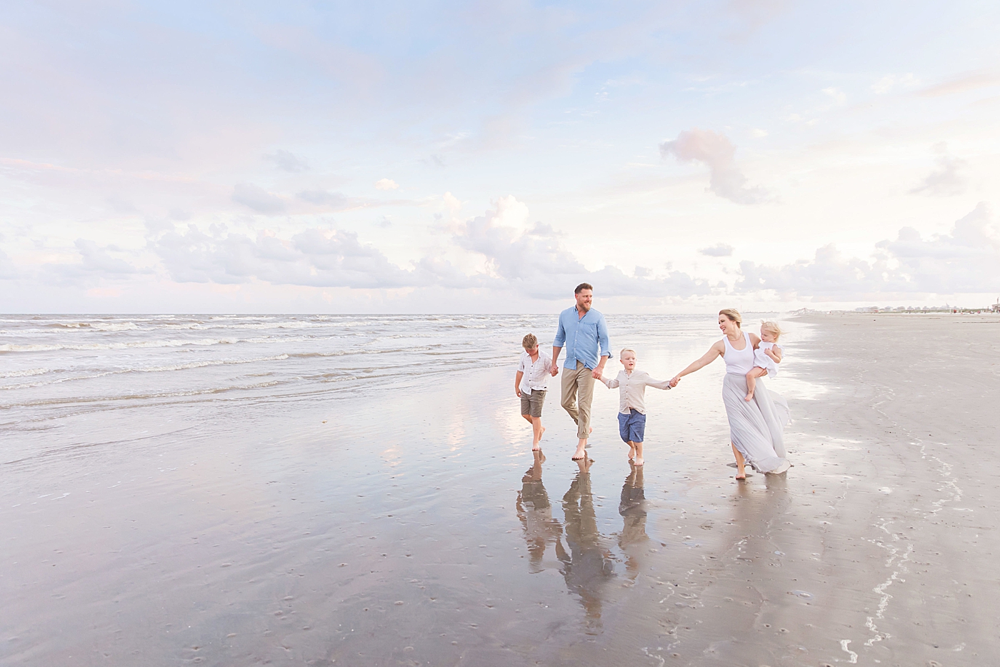 Sunset family session in Galveston on the beach. Photo by Fresh Light Photography