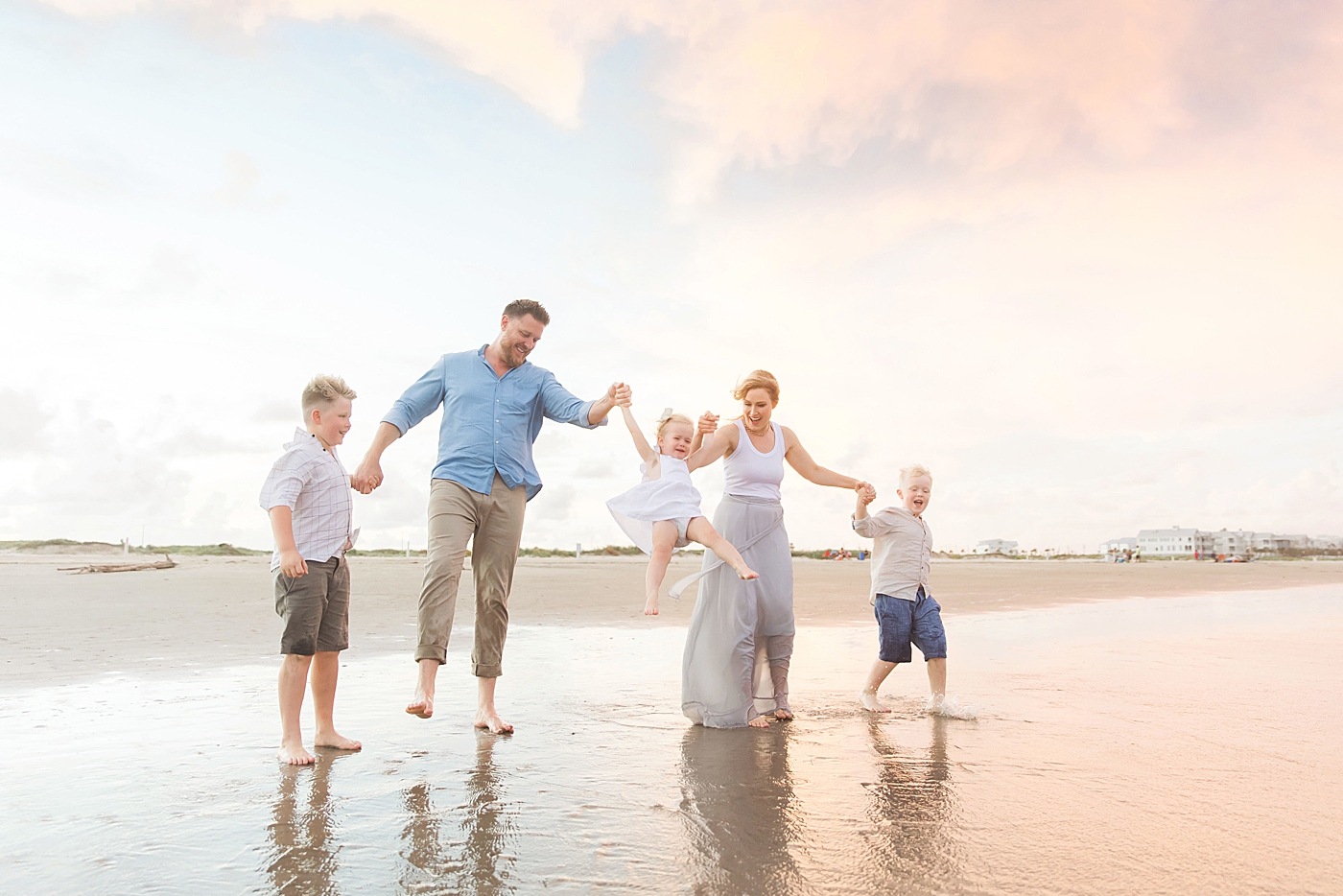 Sunset family session on the beach. Photo by Fresh Light Photography