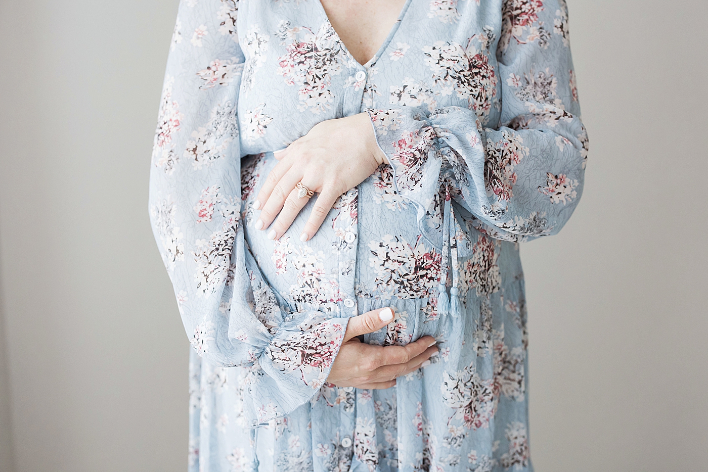 Mom wearing blue floral dress for maternity photos with Fresh Light Photography.